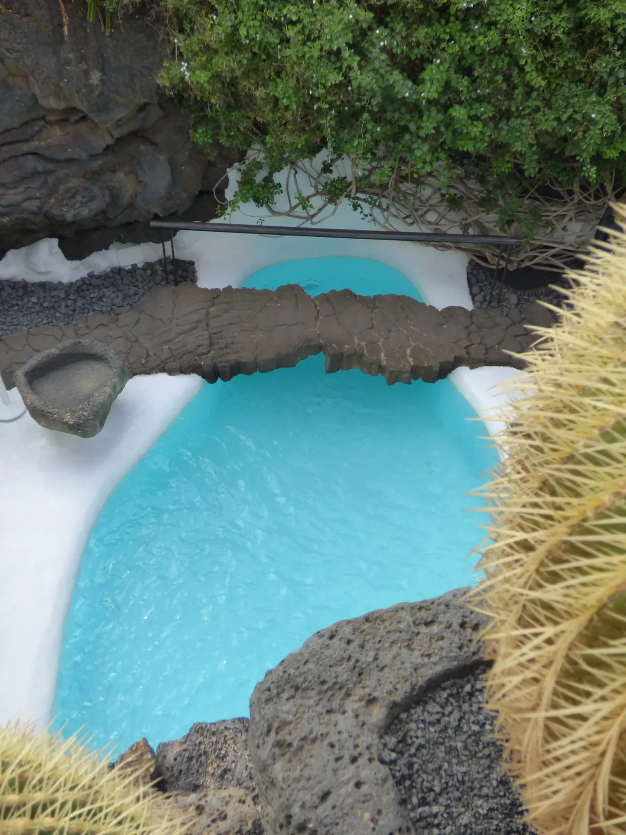 Turquoise pool carved into the lava flow