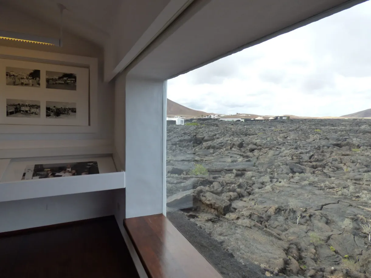 Picture window opening onto a lava field from the room