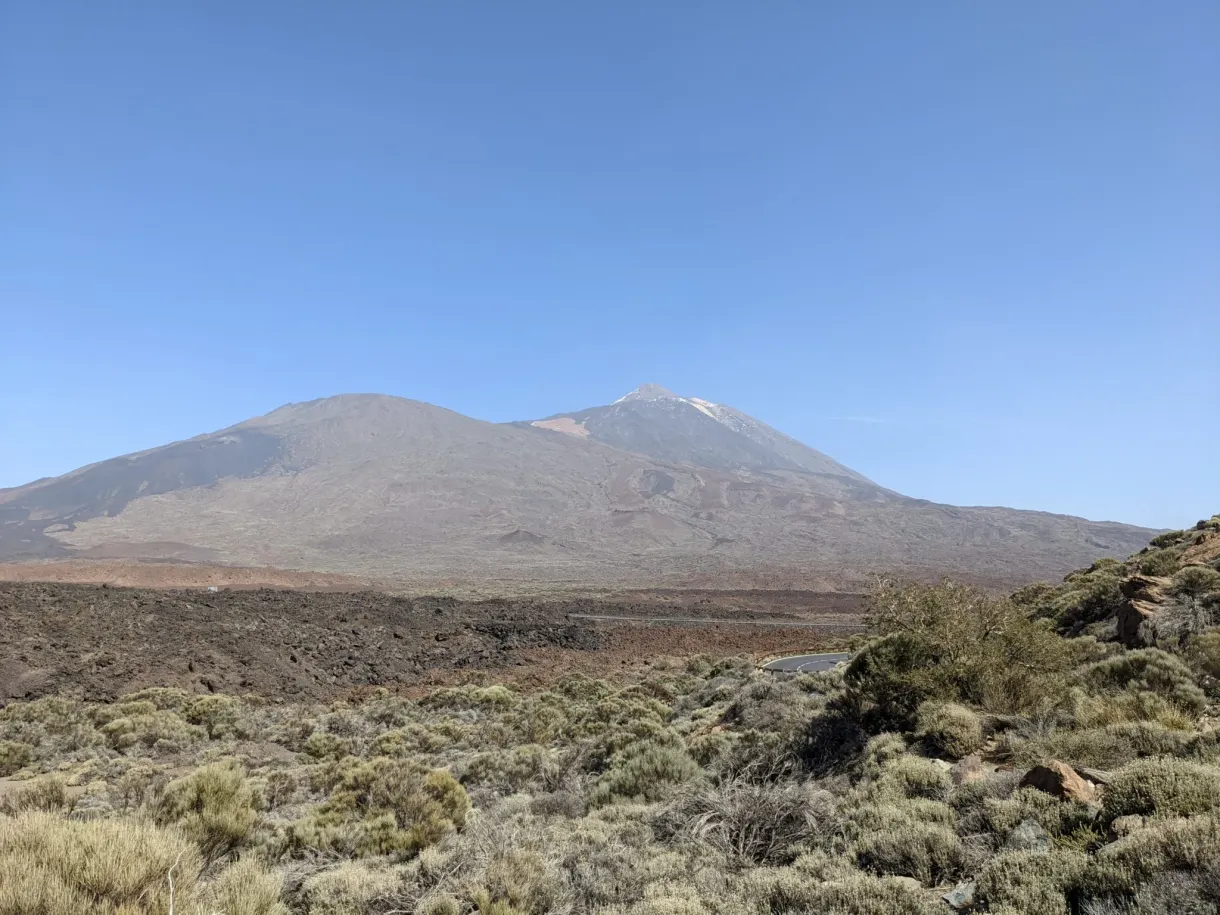 Plain of scrub opening onto two volcanic summits