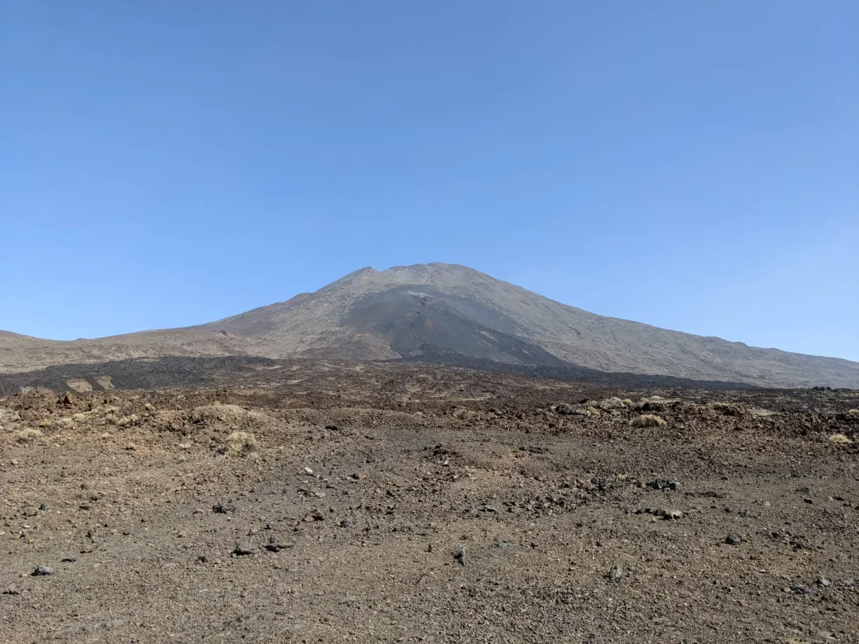 Field of black lava at the foot of the volcanic cone