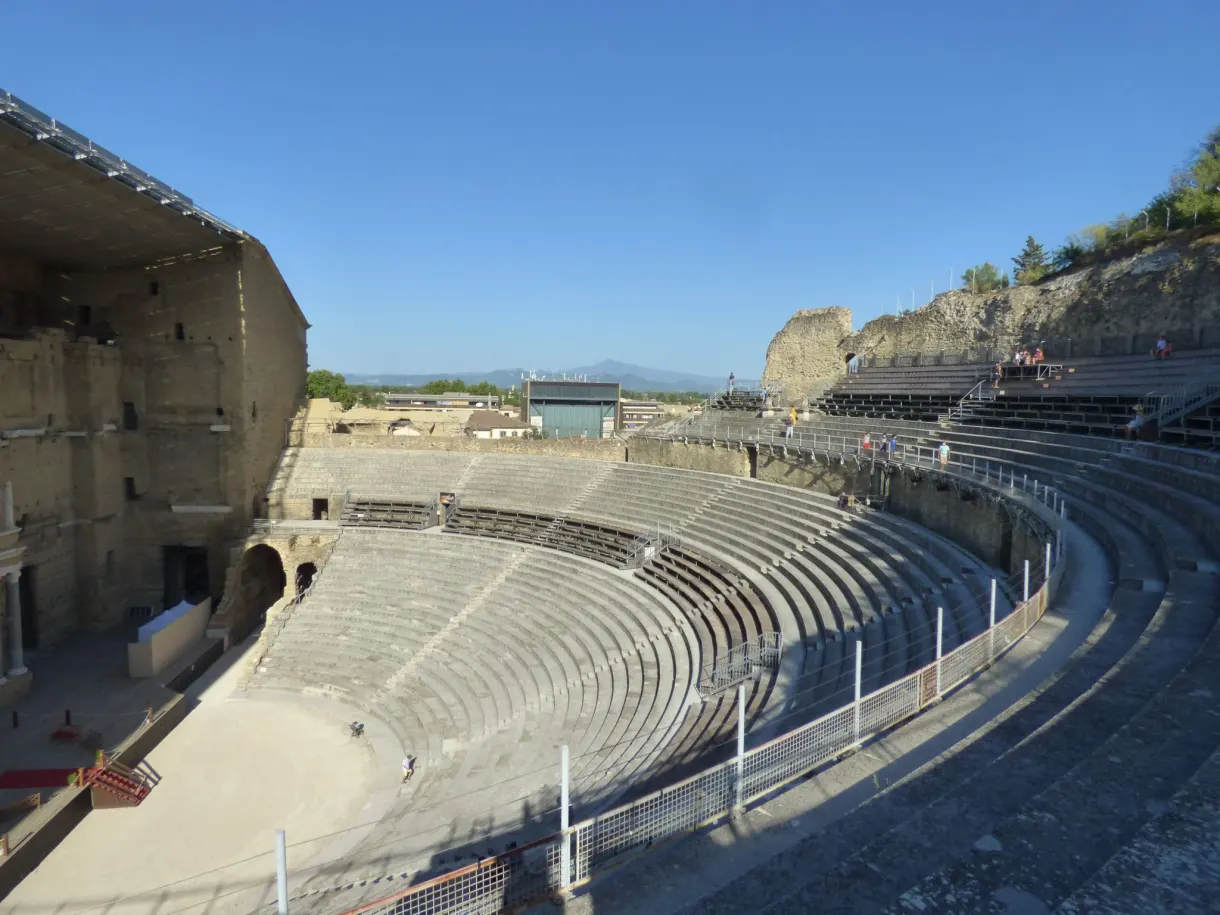 Empty auditorium of the Roman theatre under a cloudless sky