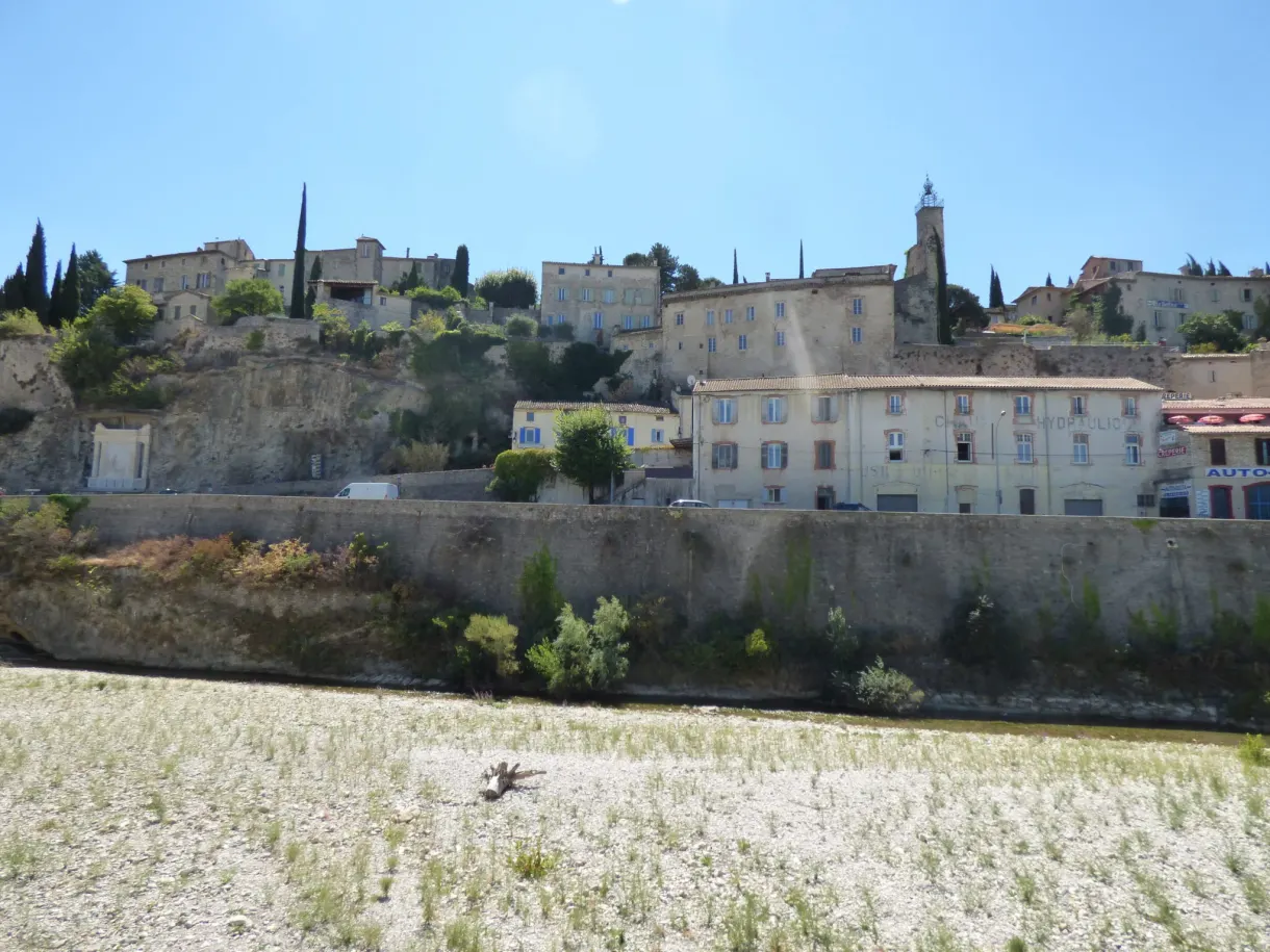 Upper town crowning its hill above the dry fields