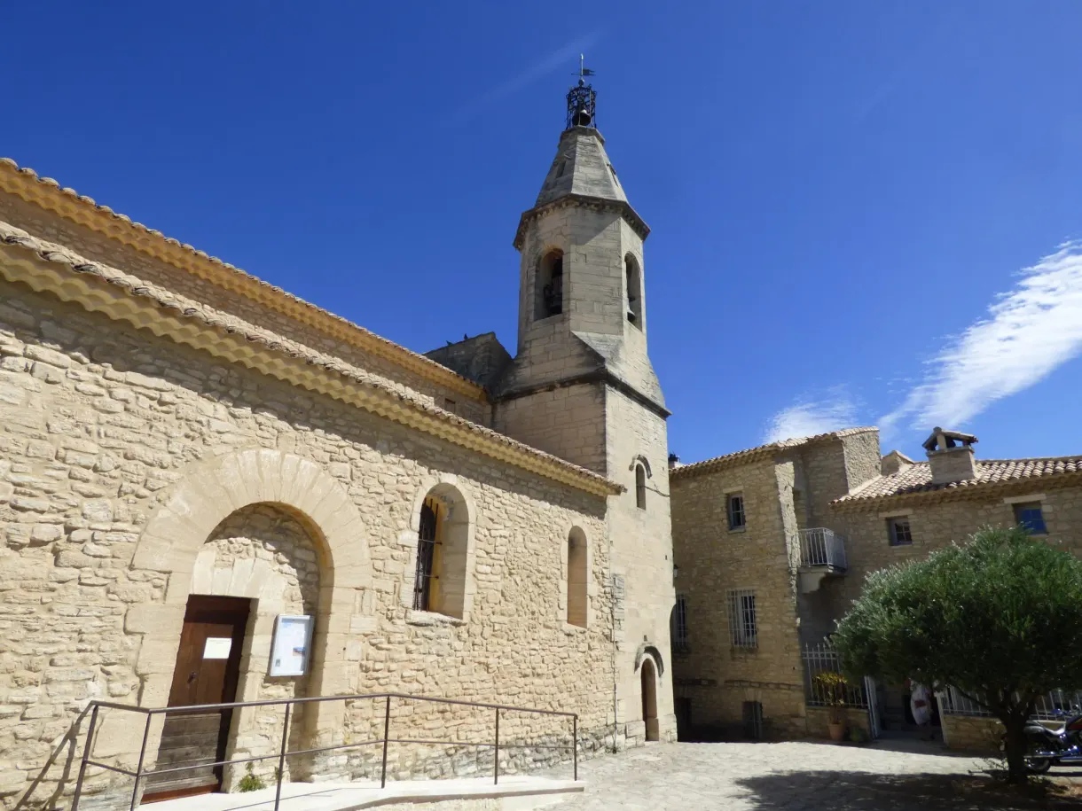 Church of Crillon-le-Brave and its bell tower on the deserted square