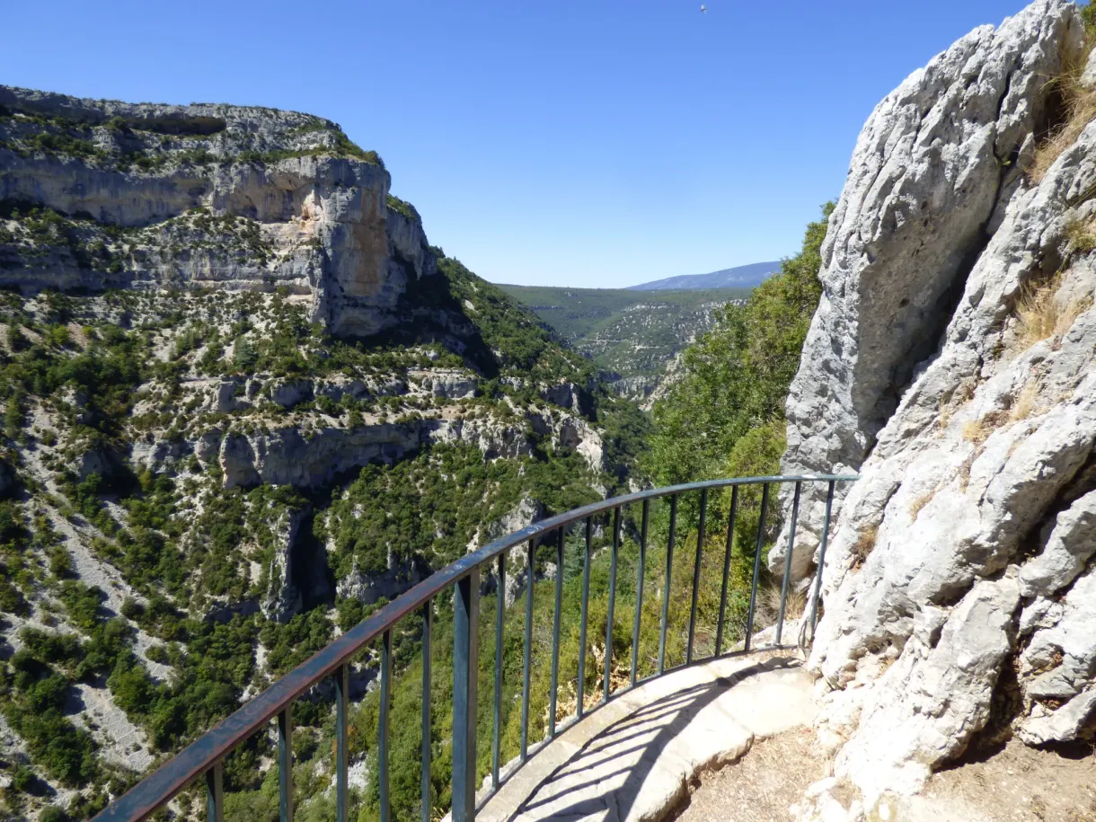 Railing of the viewpoint slipped between two white rocks