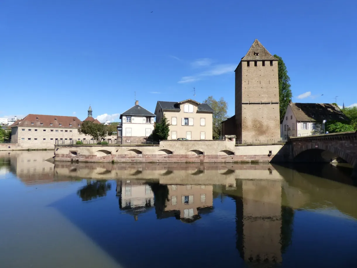 Square tower of the Ponts Couverts reflected in the Ill
