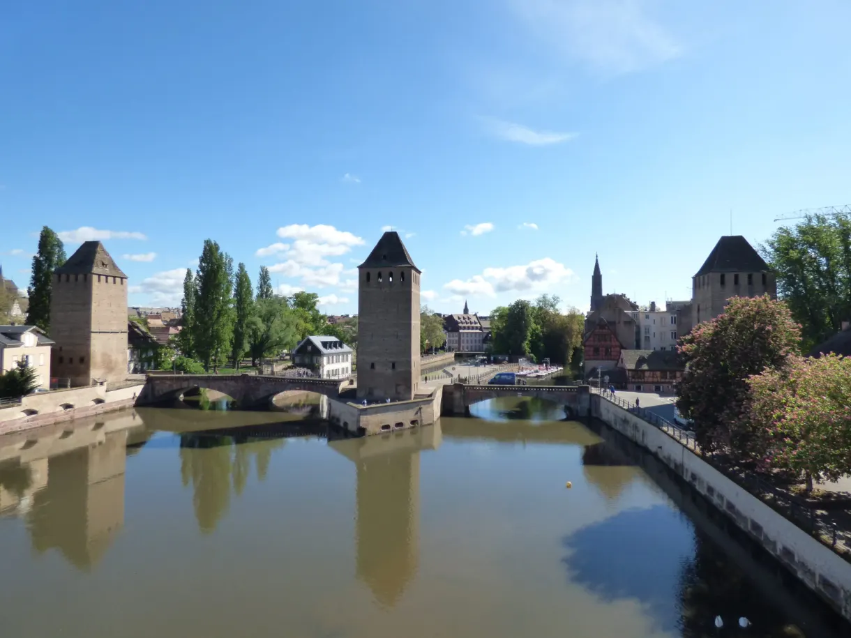 The four towers of the Ponts Couverts lined up along the canal