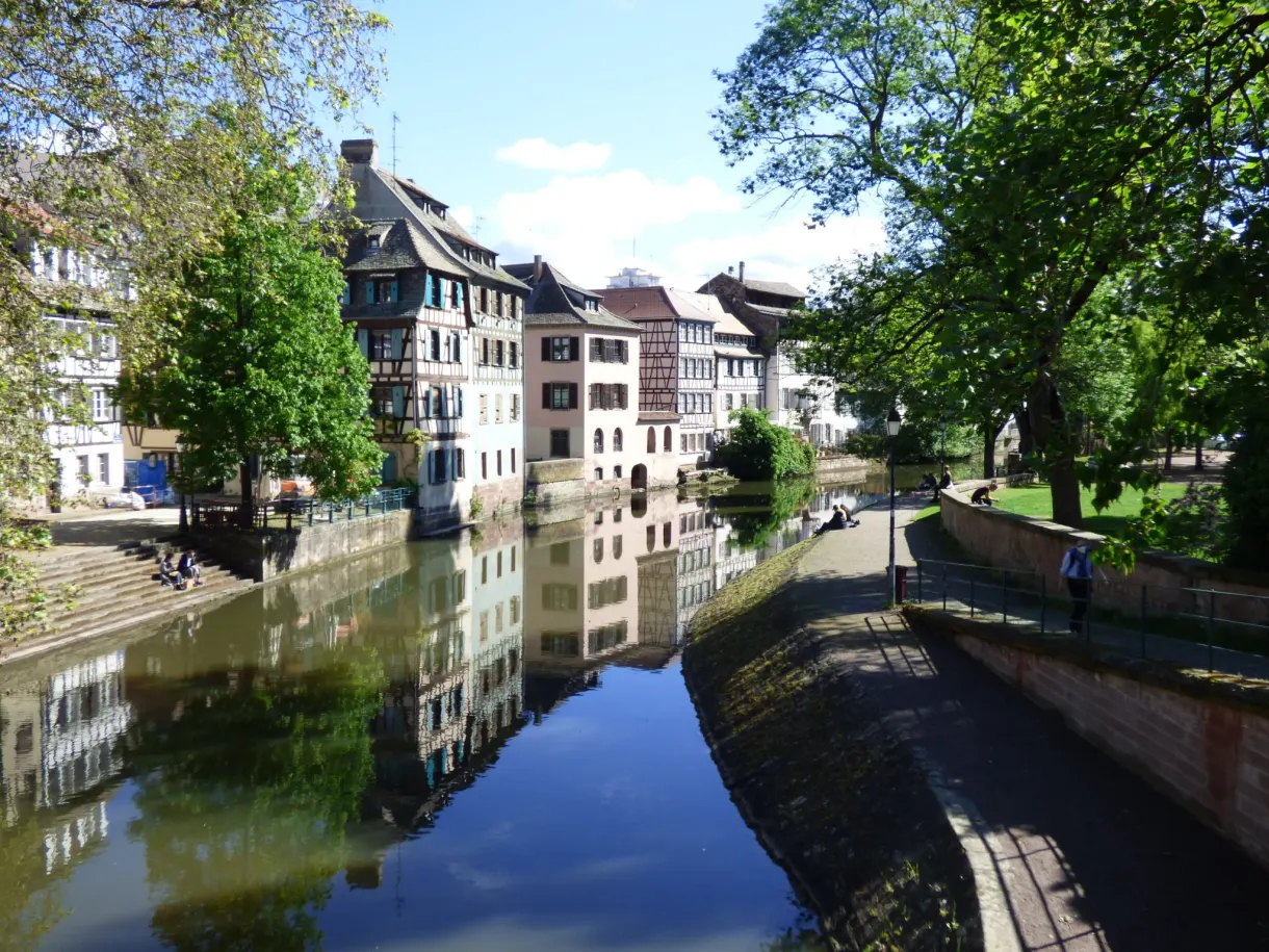 Colourful houses lined up along the canal and its quay