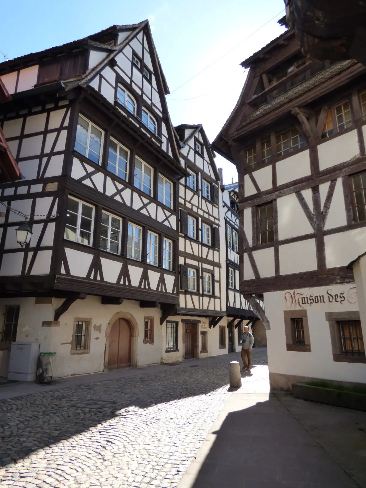 Cobbled lane between two tall timber-framed houses