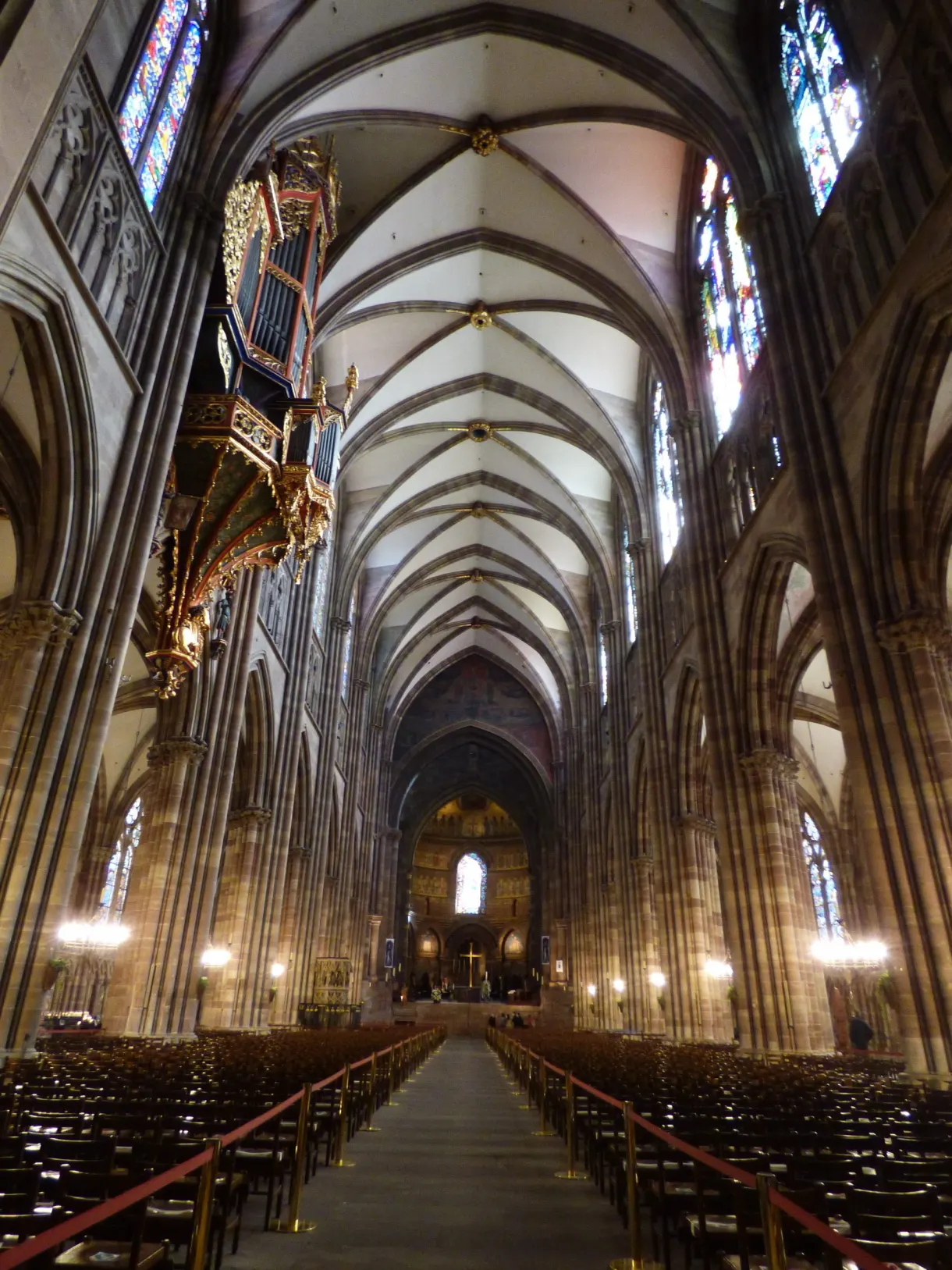 Long Gothic nave and rows of chairs beneath the vaults