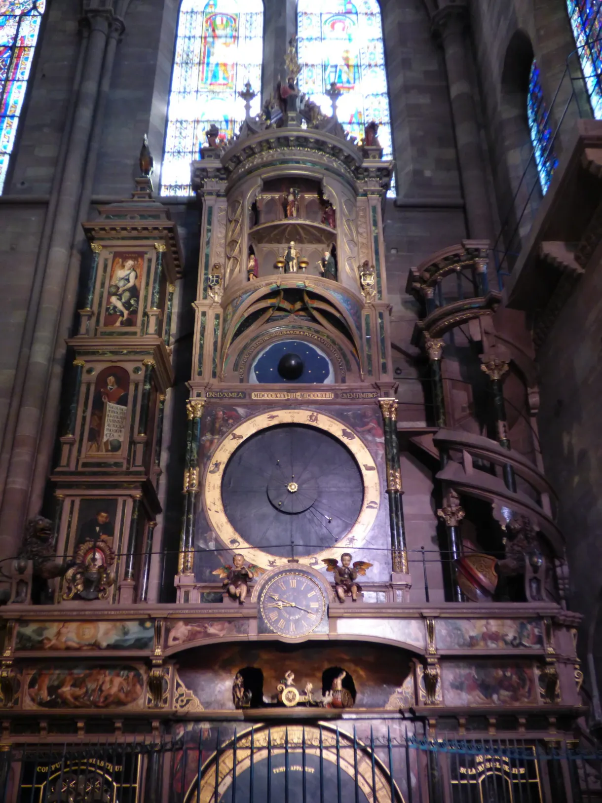 Astronomical clock and its carved automata in the half-light