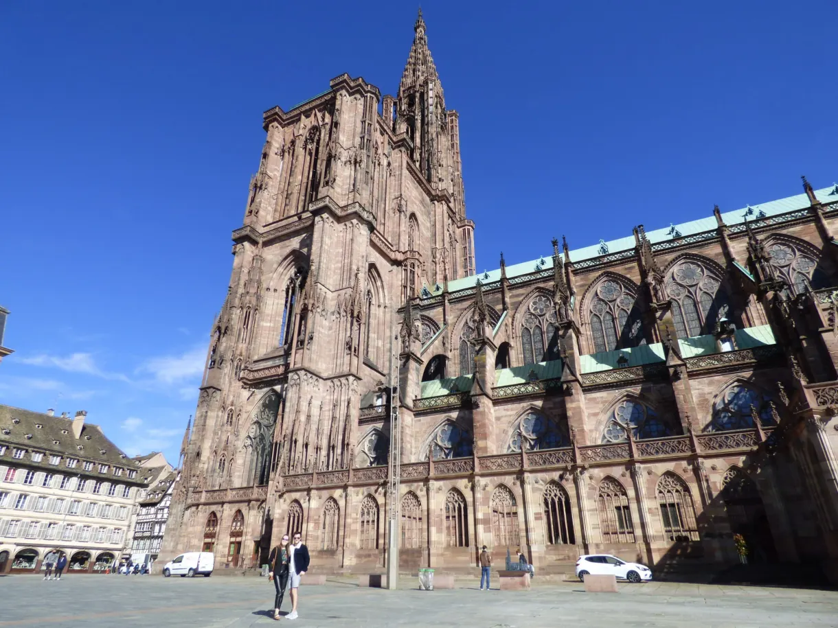 Side of the cathedral and its green roof seen from the square