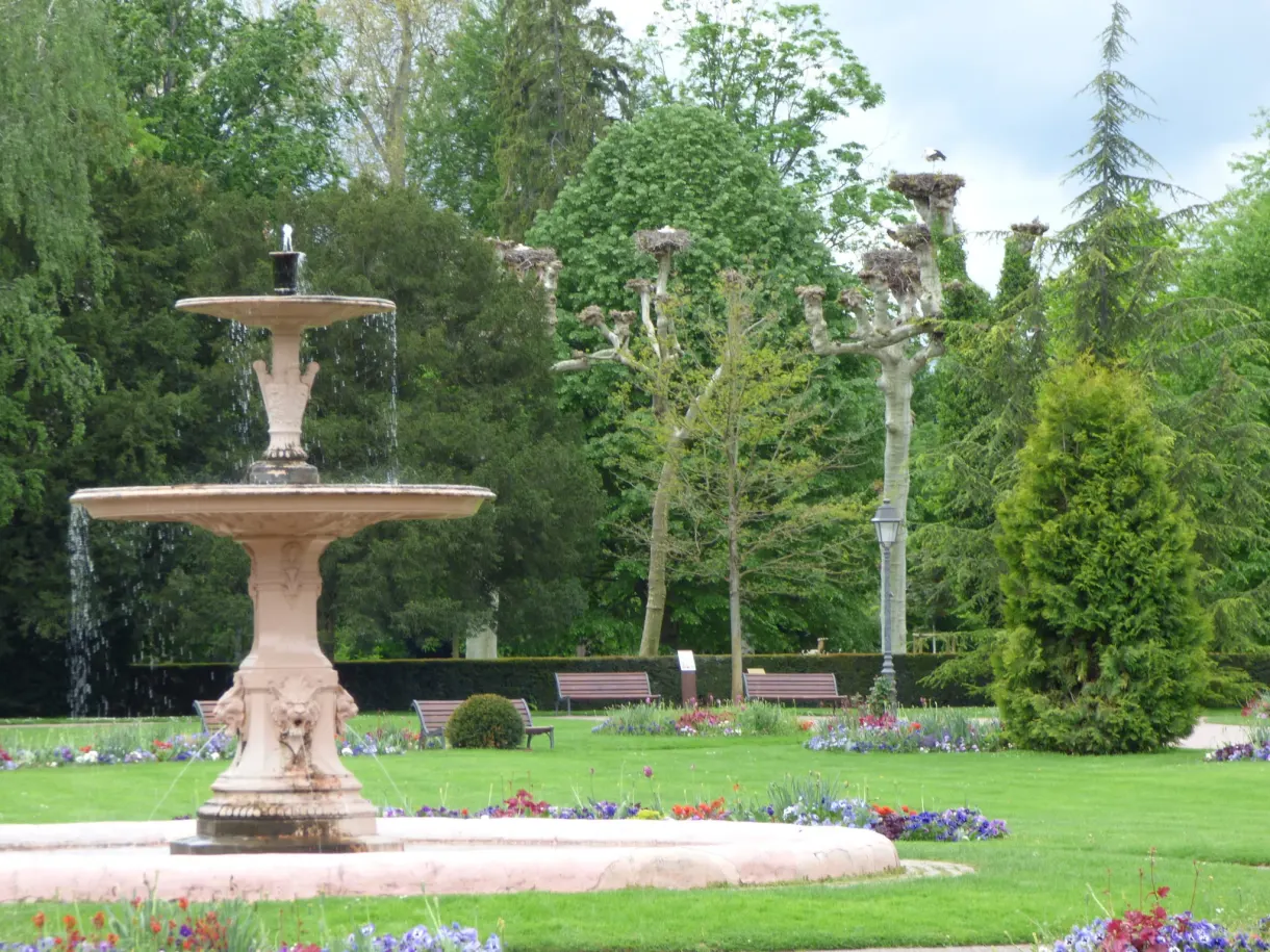 Tiered fountain amid the flower beds of the park