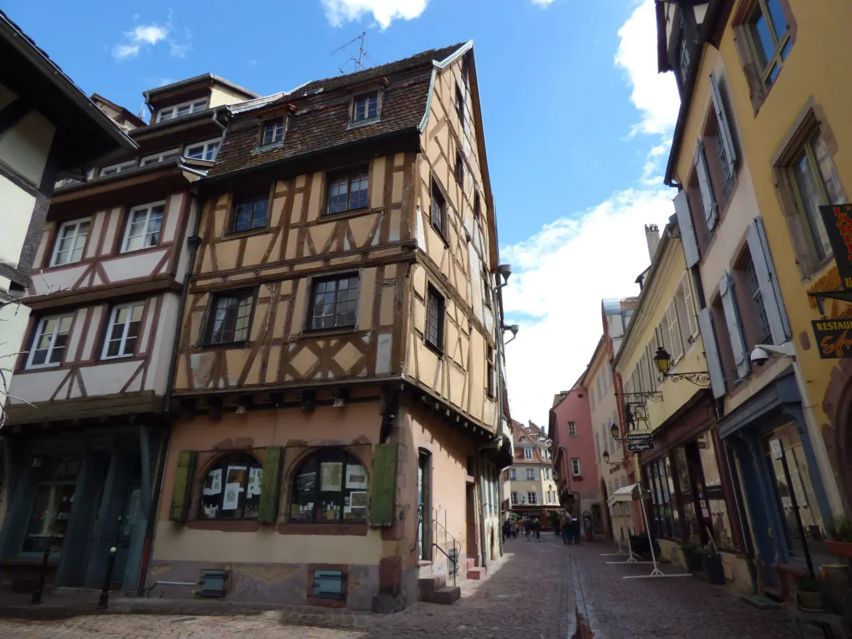 Timber-framed corner house opening onto two lanes
