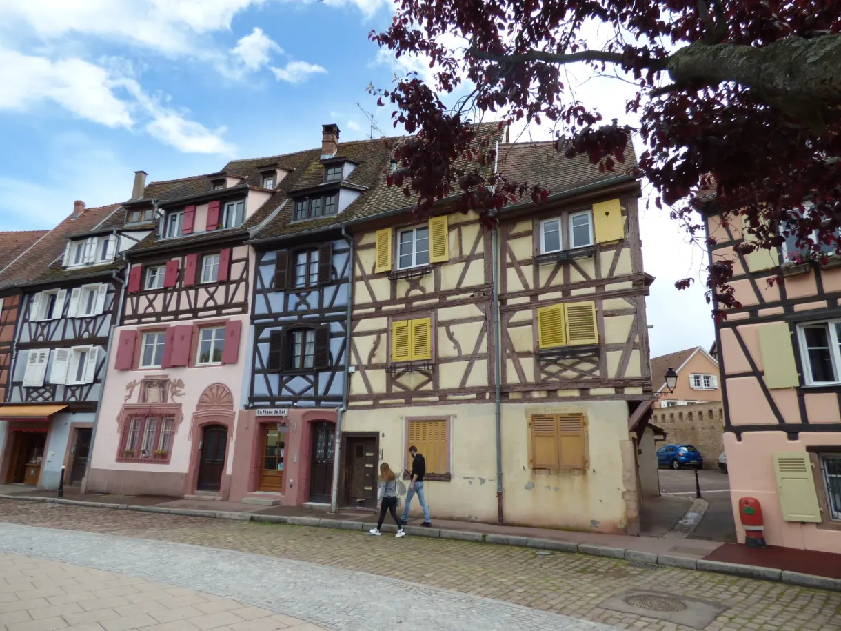Pastel half-timbered houses lining a cobbled square