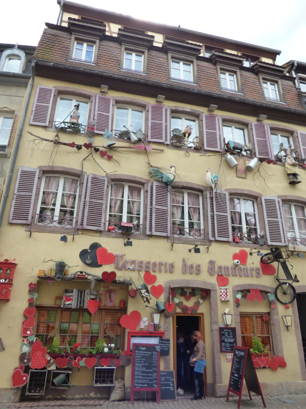 Brasserie decorated with red hearts and menu boards