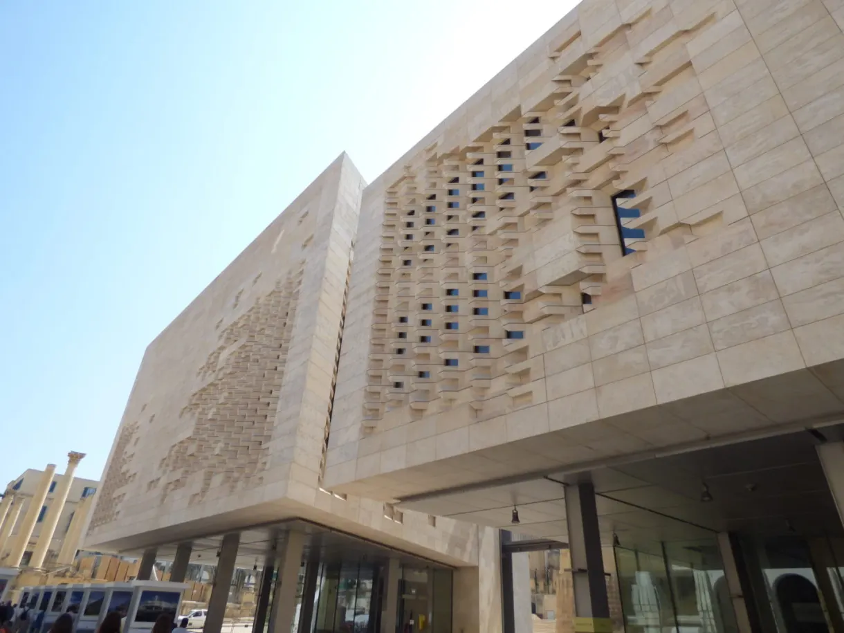 Modern building in golden stone with irregular openings