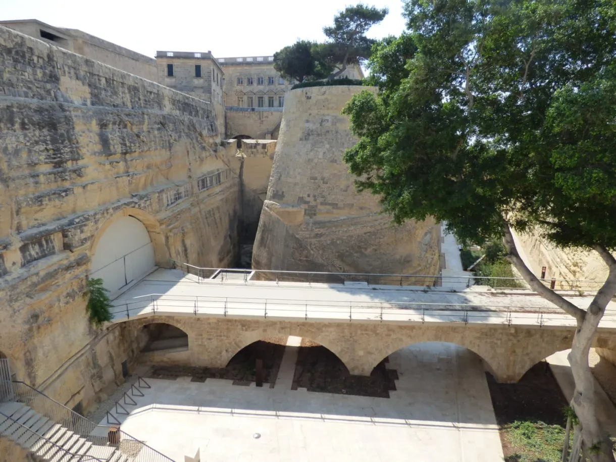 Stone arches and ramparts at the foot of the old town