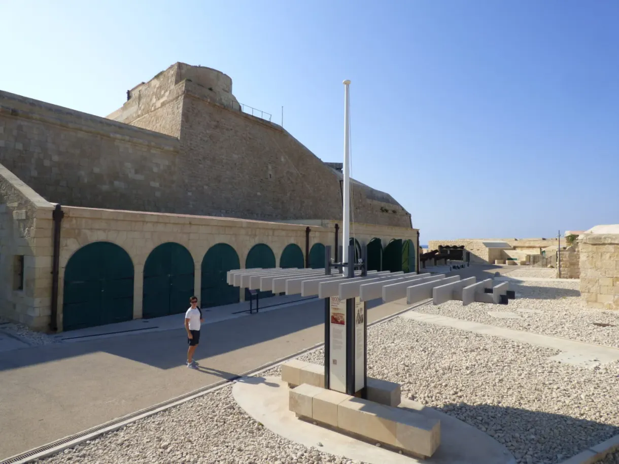 Gravel esplanade and bastion under a cloudless sky