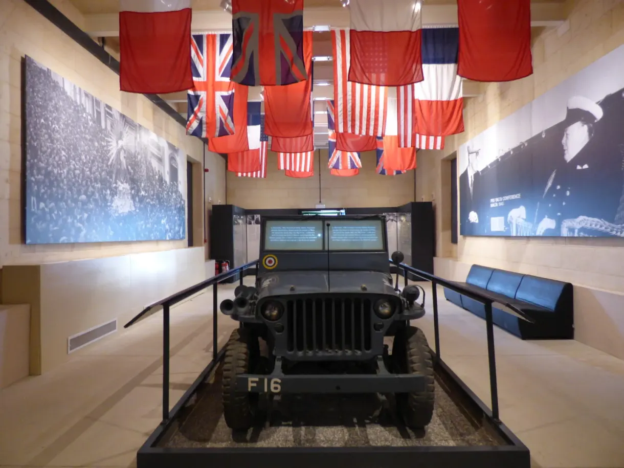 Military jeep on display under the Allied flags