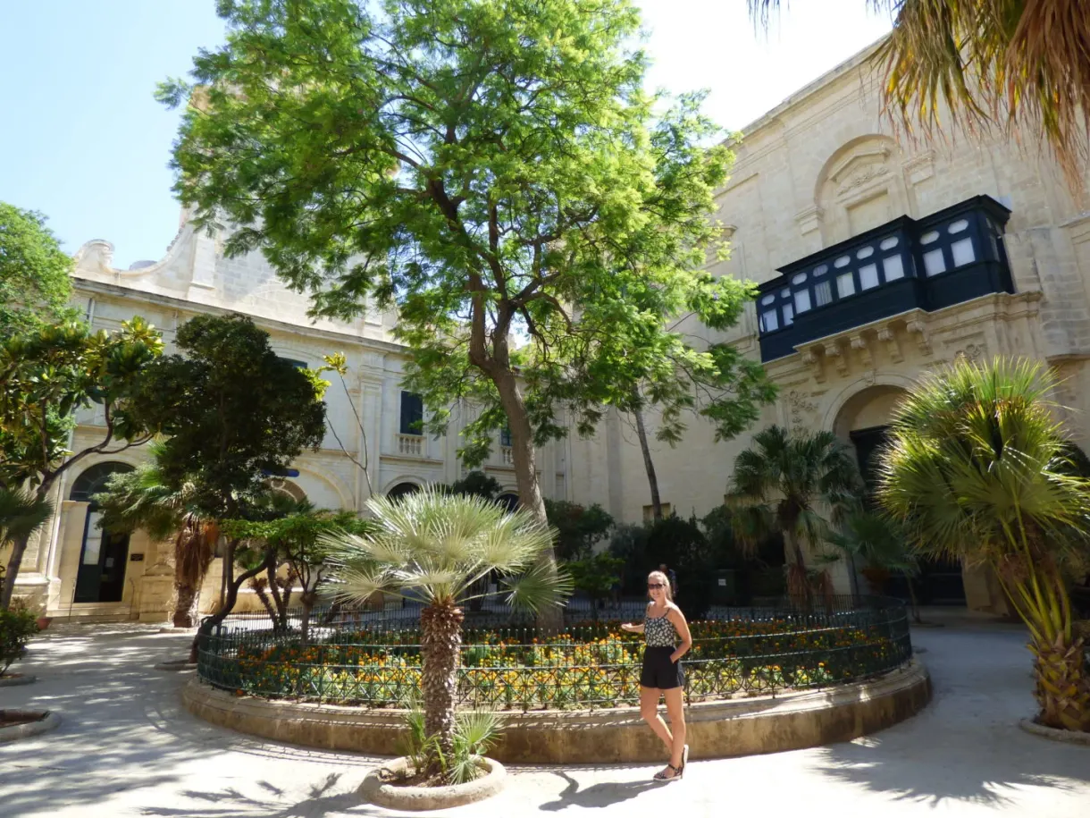 Inner courtyard planted with trees and flower beds