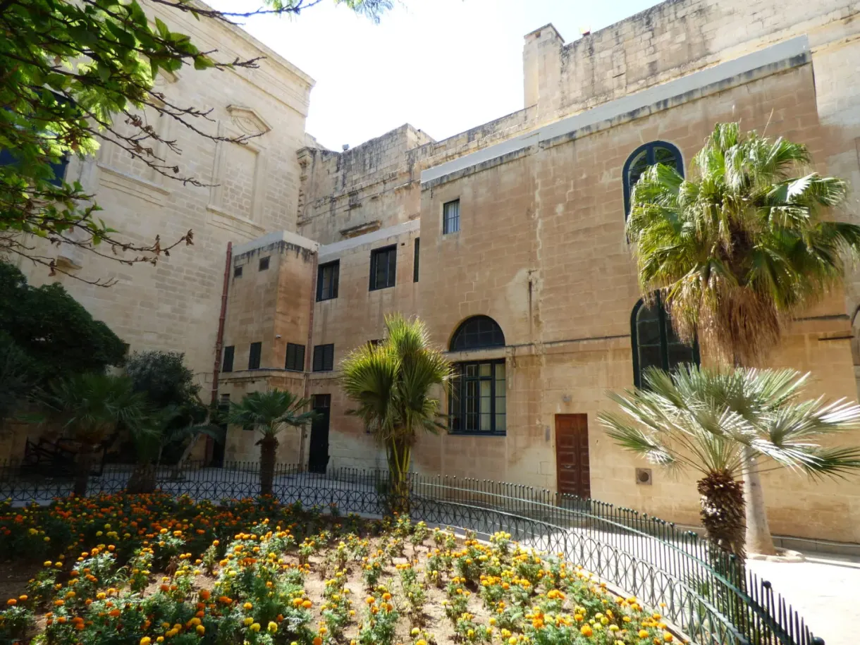 Second patio of the palace, flower beds and palm trees
