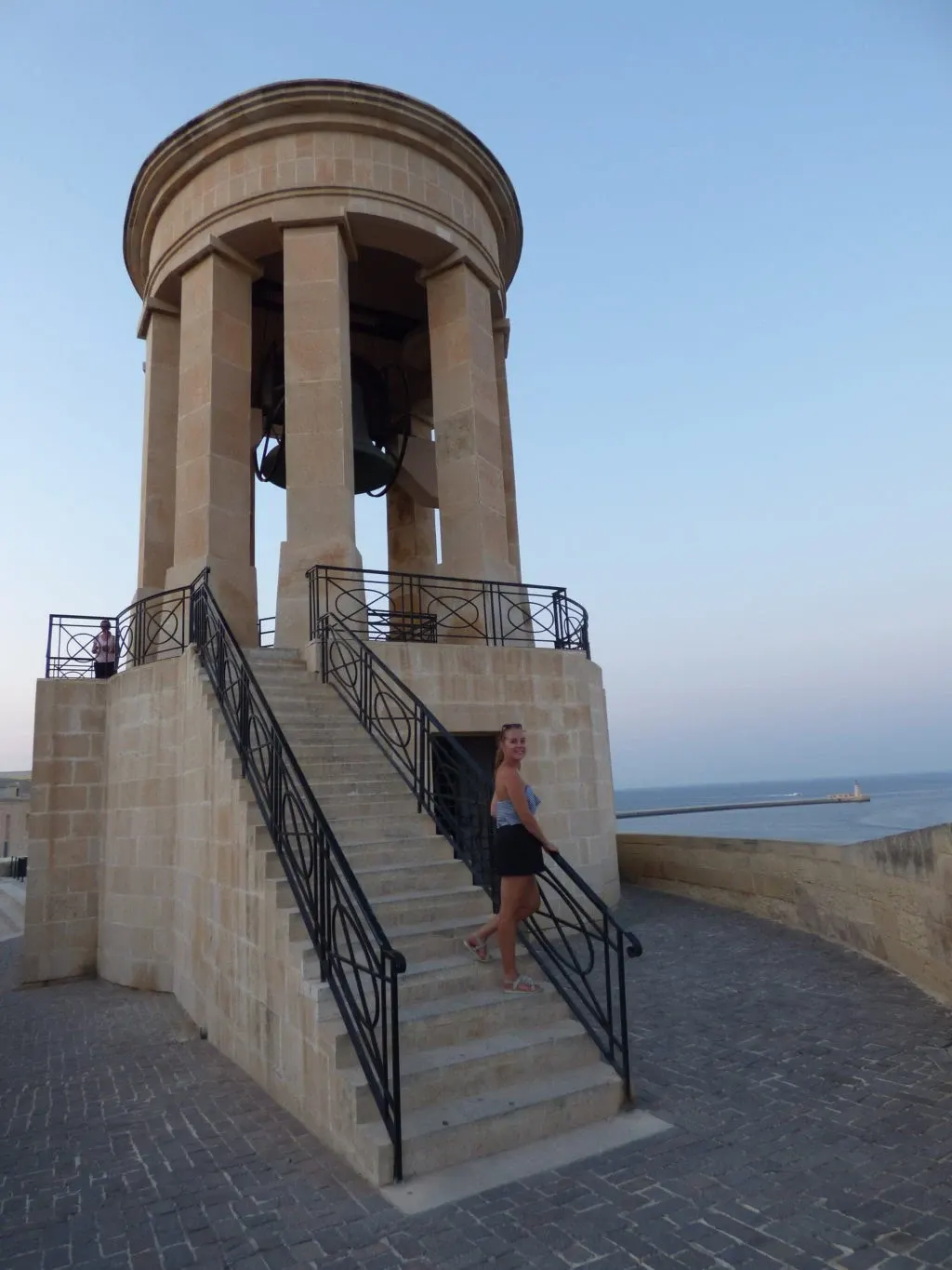 Woman climbing the stairs of the memorial bell tower