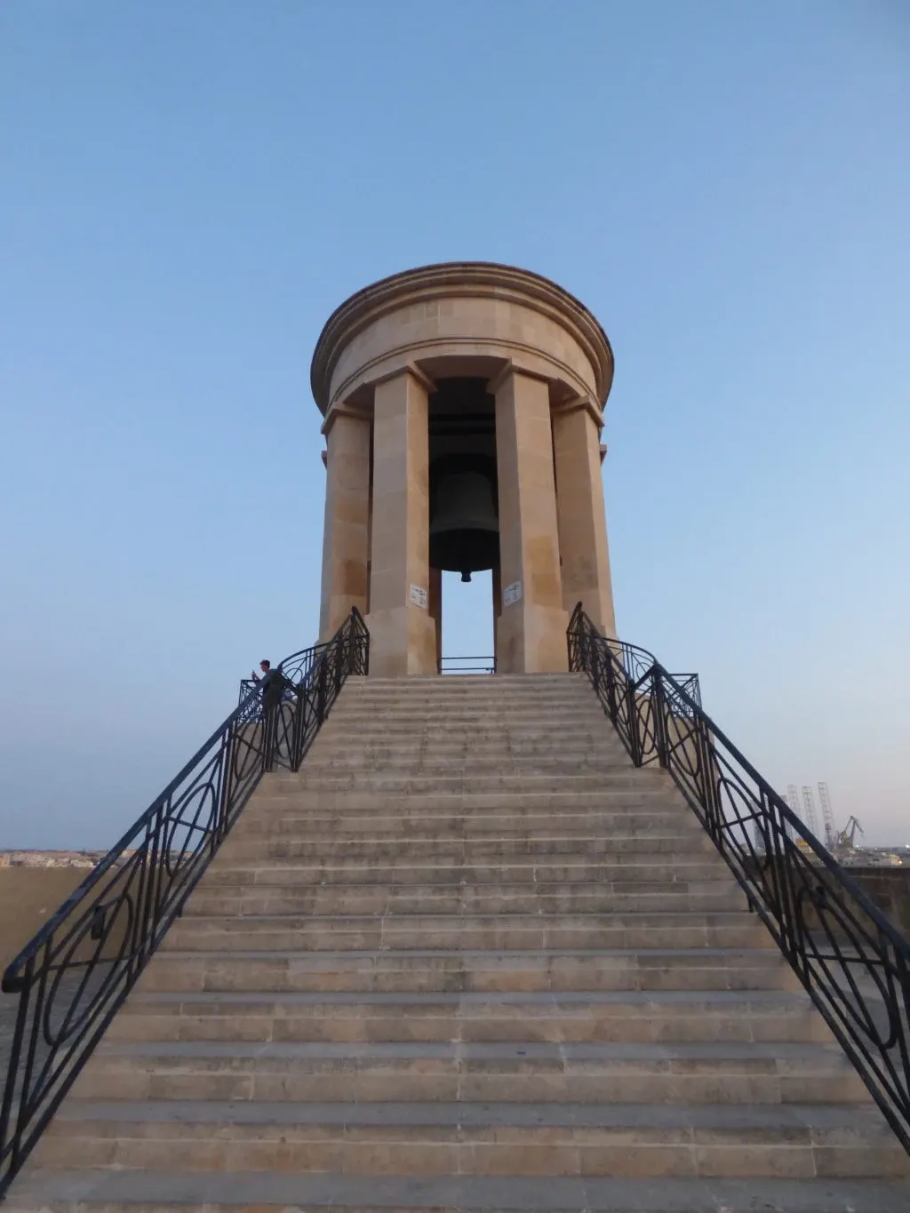 Stone staircase climbing towards the memorial