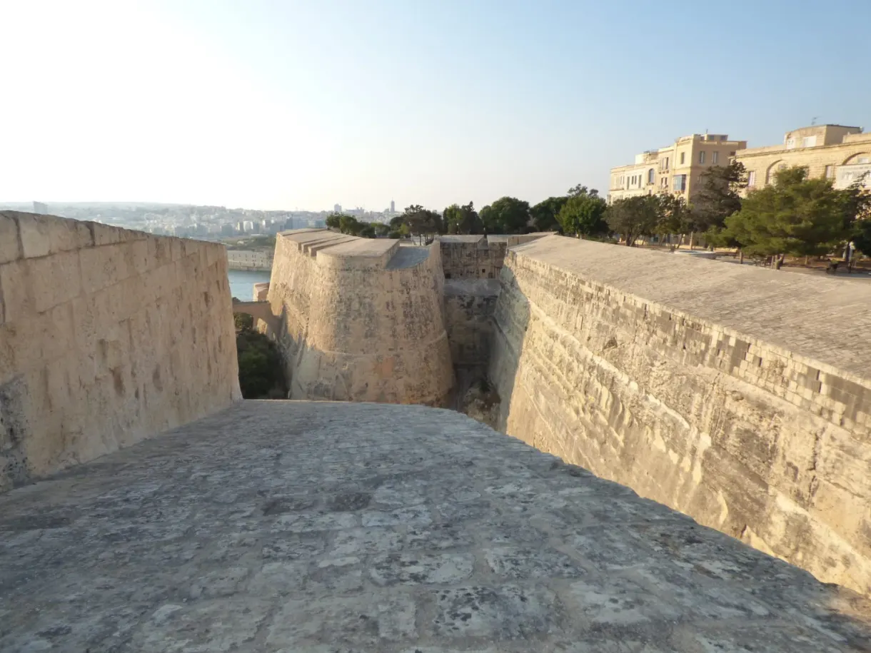 Massive ramparts and stone ditch seen from the garden