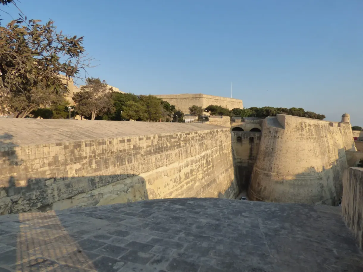 Bastion and moat bathed in golden light