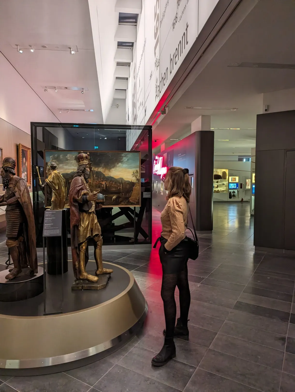 Marie standing in front of a piece at the Centre Charlemagne