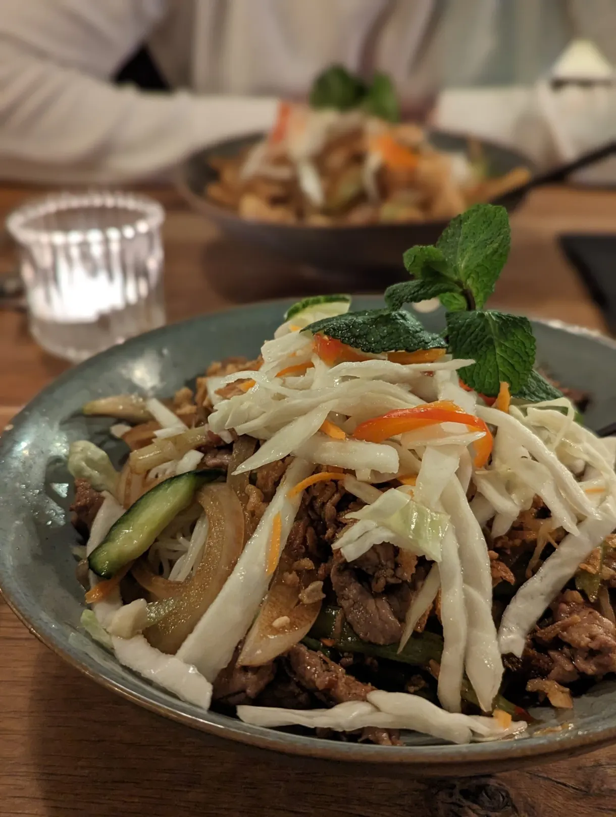 Bowl of crunchy cabbage, vegetables and shredded meat