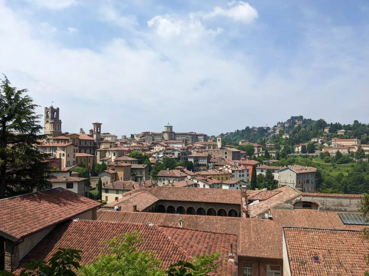 Ochre roofs of the upper town and hills on the horizon