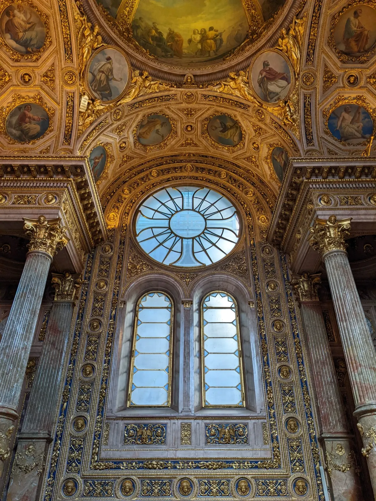 Painted vault and gilded dome of a Baroque interior