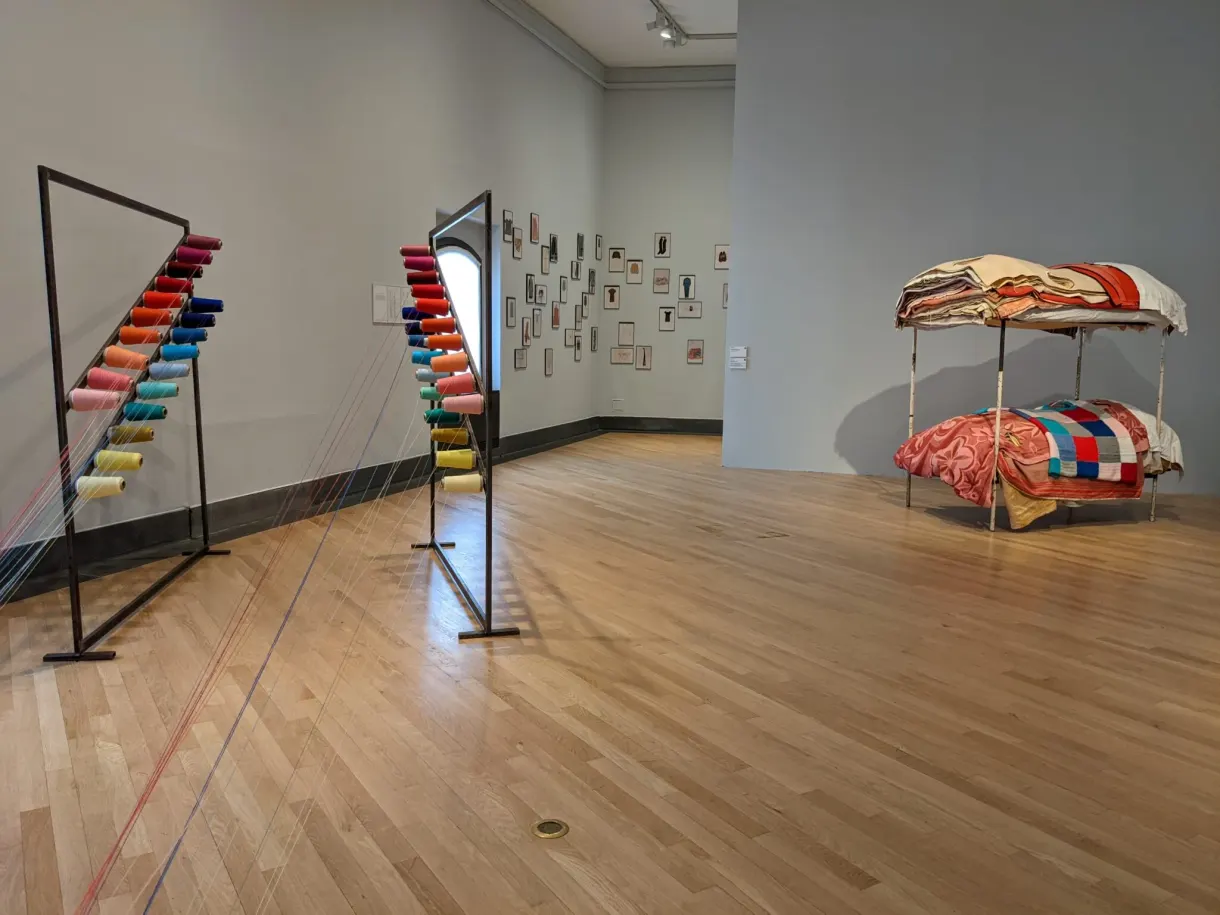 Contemporary museum room, pale parquet and colourful works