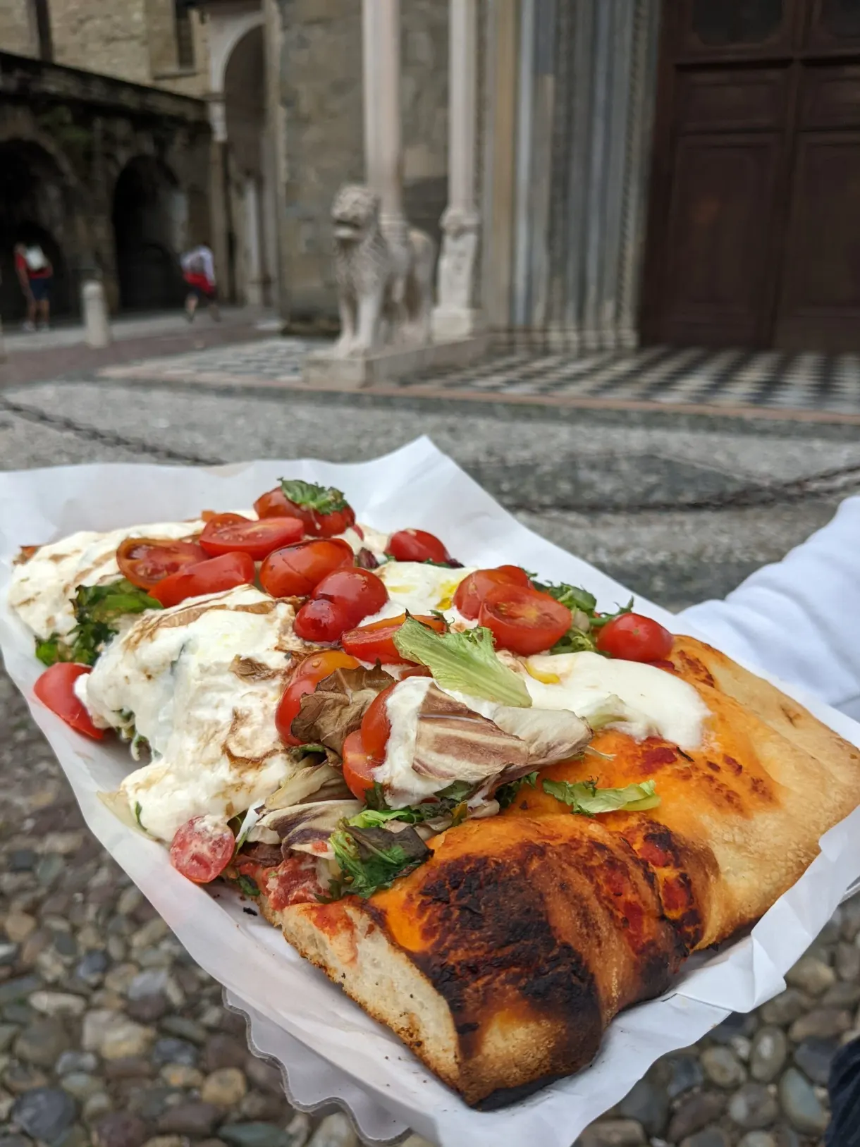 Focaccia topped with tomatoes, mozzarella and ham