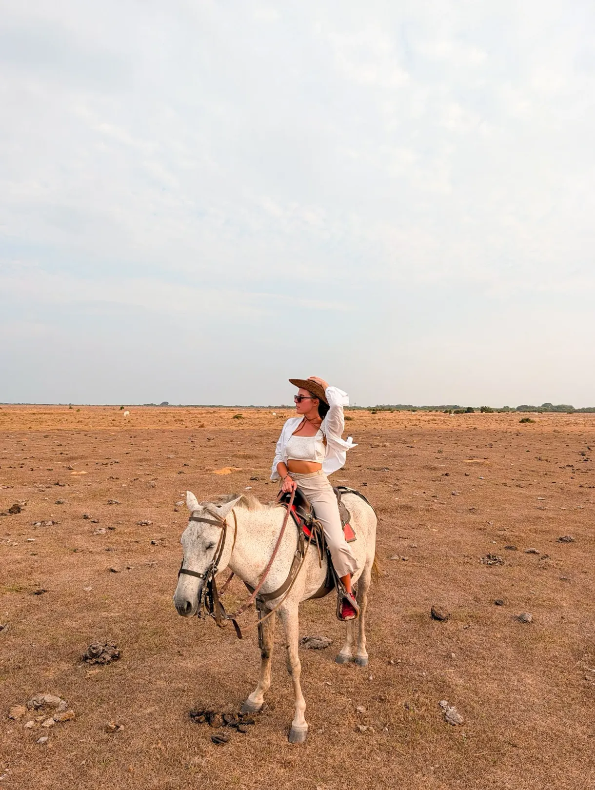 Marie on horseback across the plains of the El Encanto de Guanapalo reserve, in Colombia