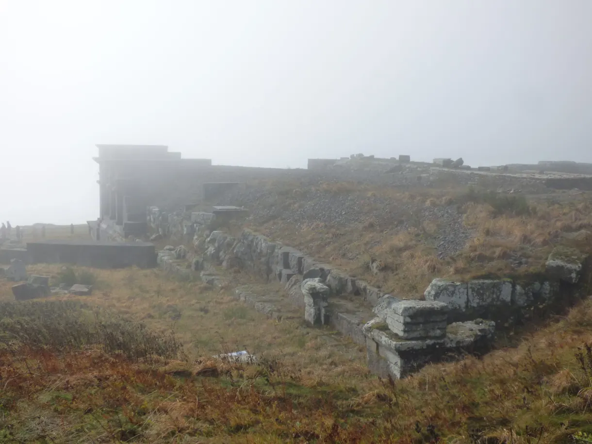 Stone remains of the Roman temple drowned in fog