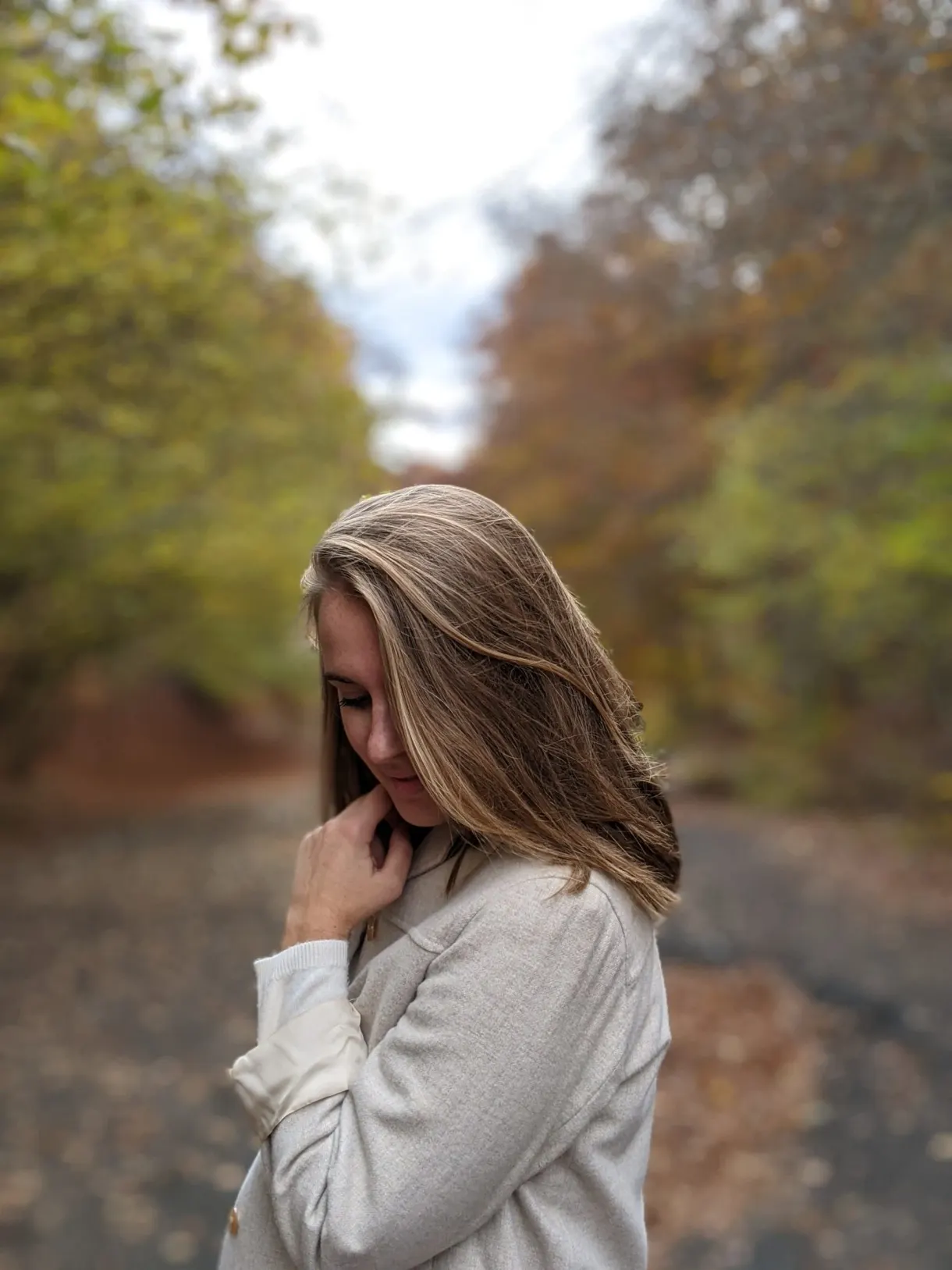Portrait of a hiker, hair in the wind on the path