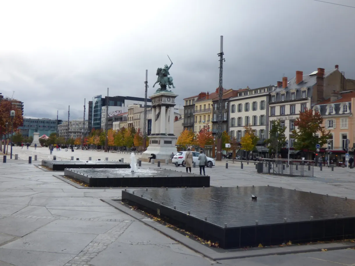 Equestrian statue at the centre of a vast paved square