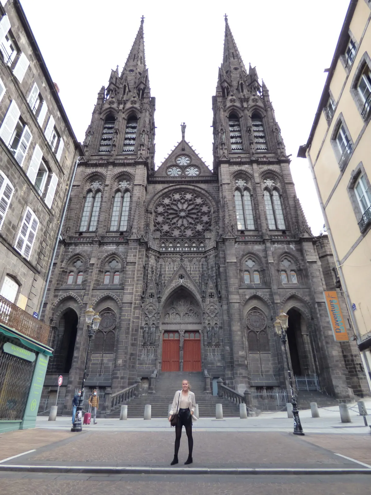 Gothic facade in volcanic stone and its two dark spires
