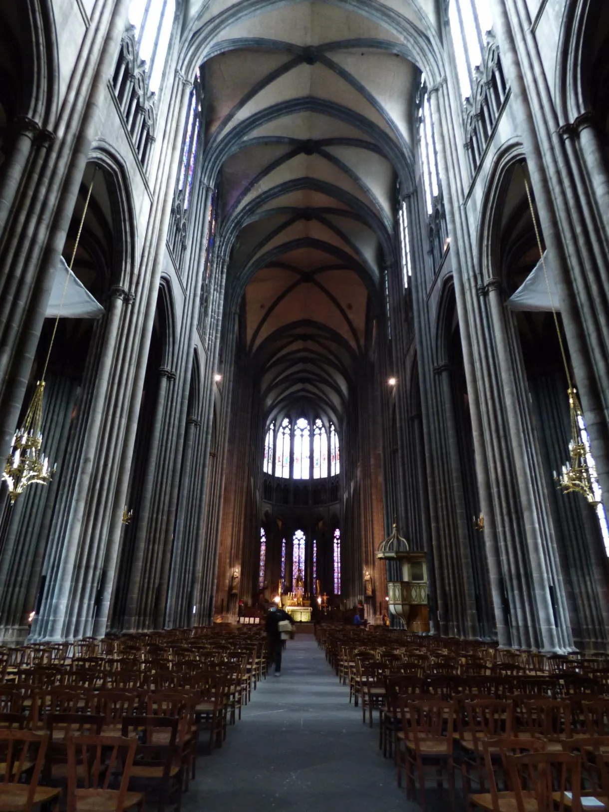 Soaring nave and rows of chairs in the half-light