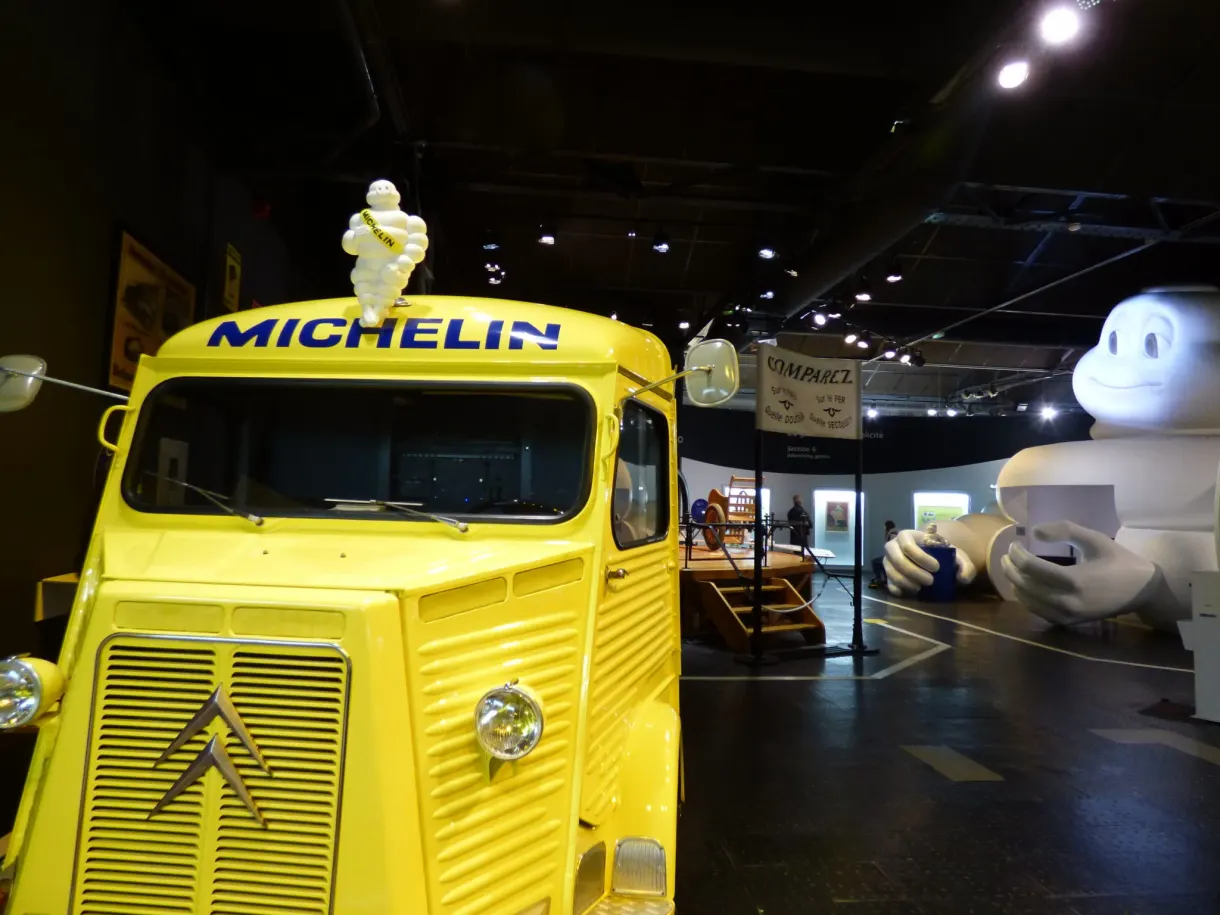 Yellow Michelin van in the middle of the Bibendums