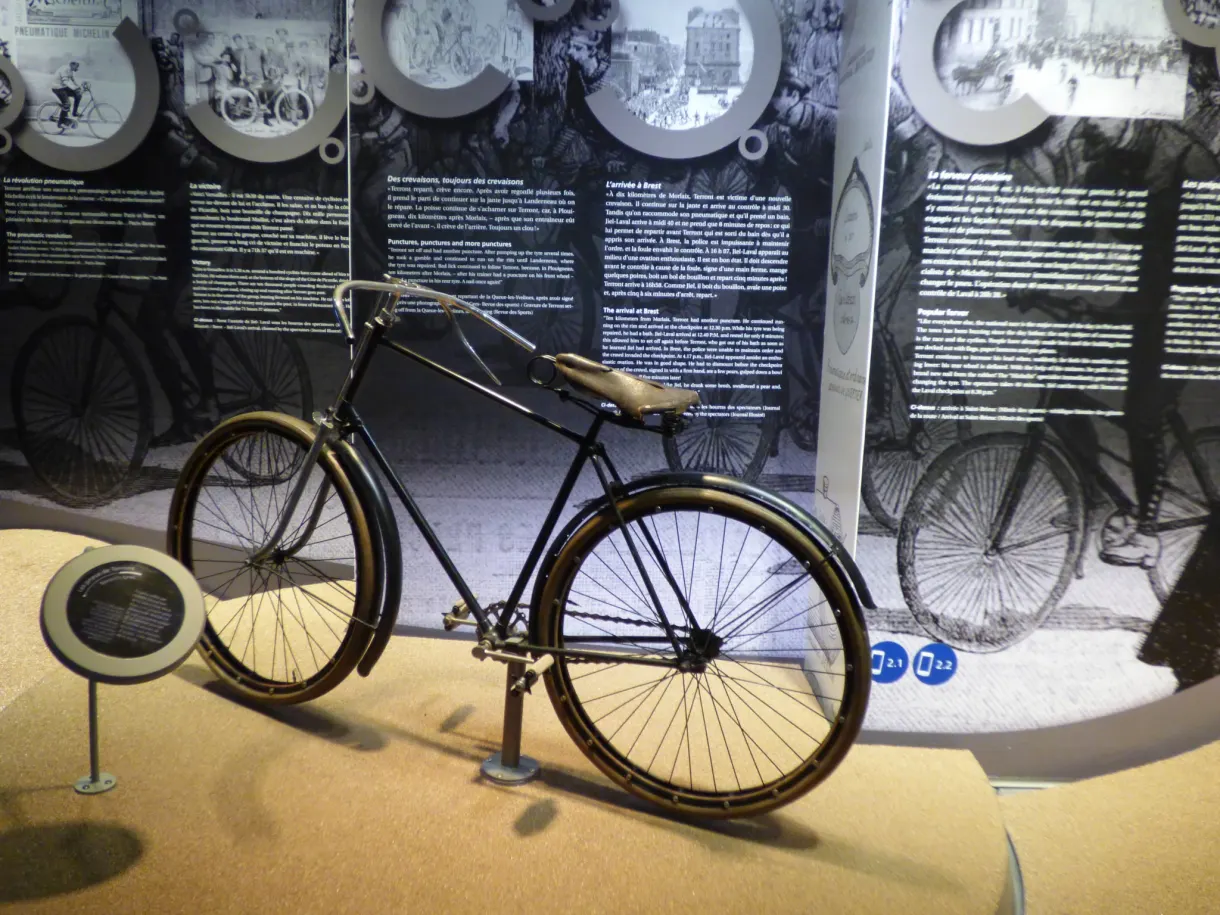 Vintage bicycle on show in front of history panels
