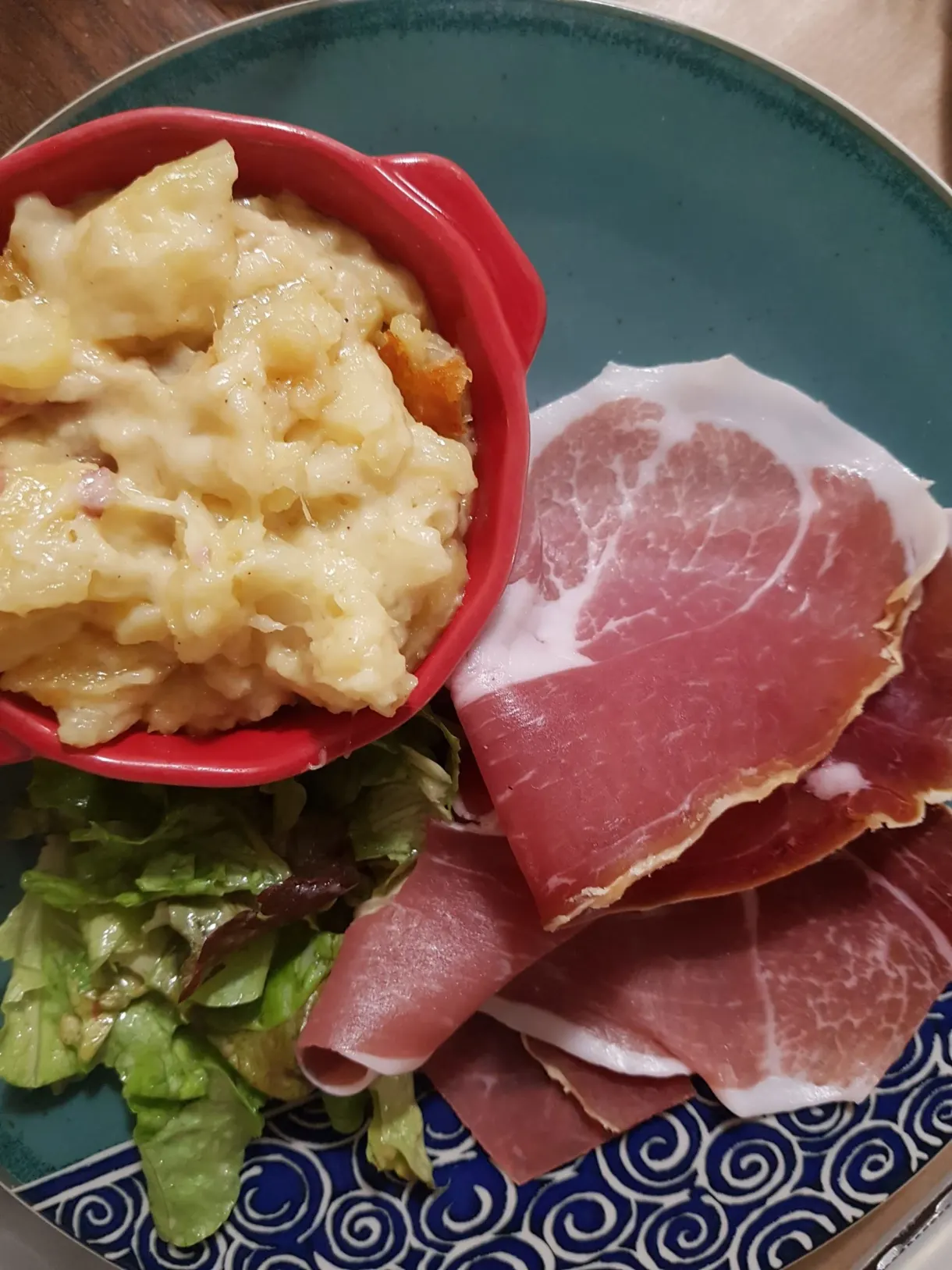 Stringy aligot served with a plate of charcuterie