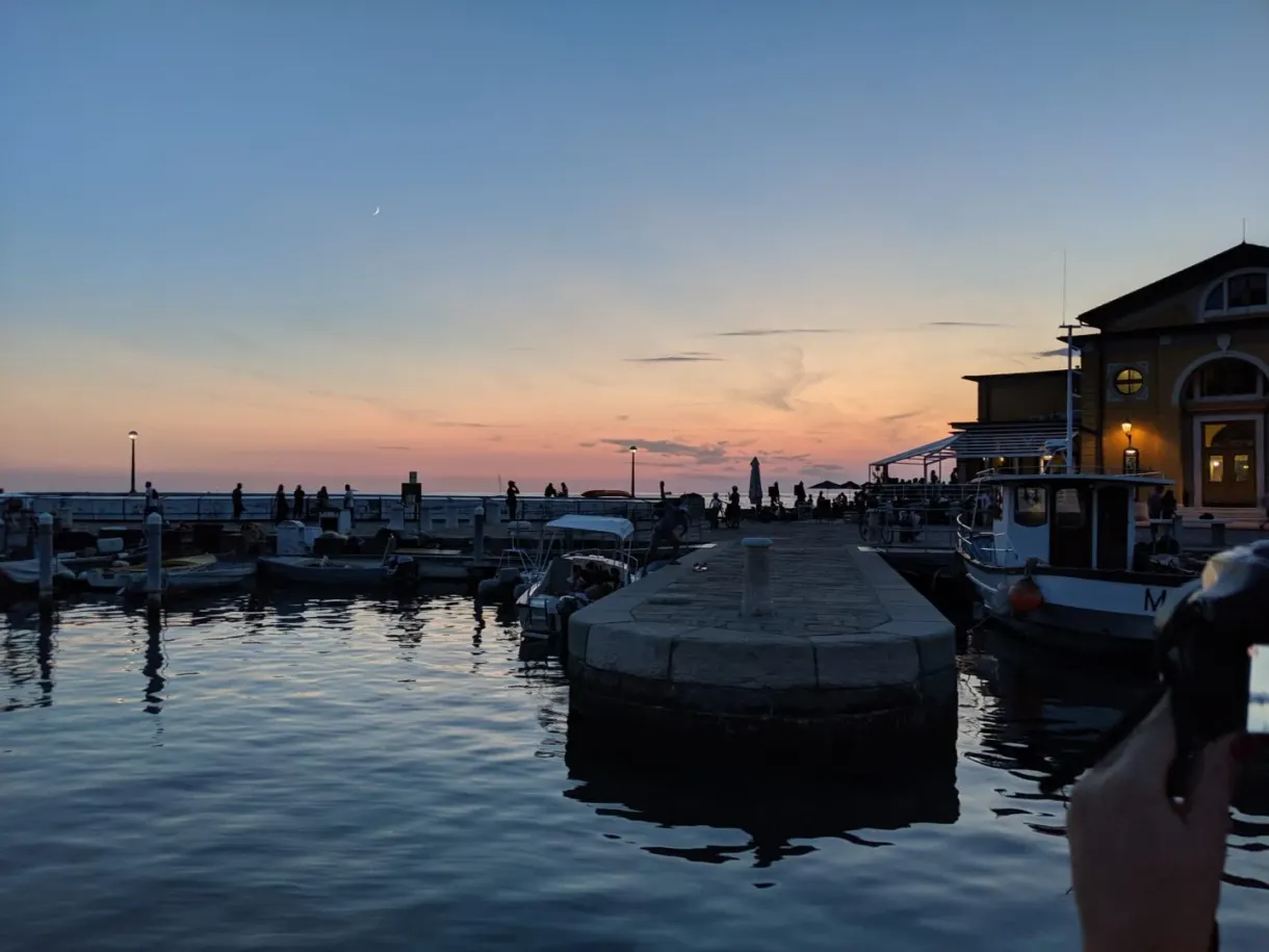 Harbour basin at dusk under a pink sky