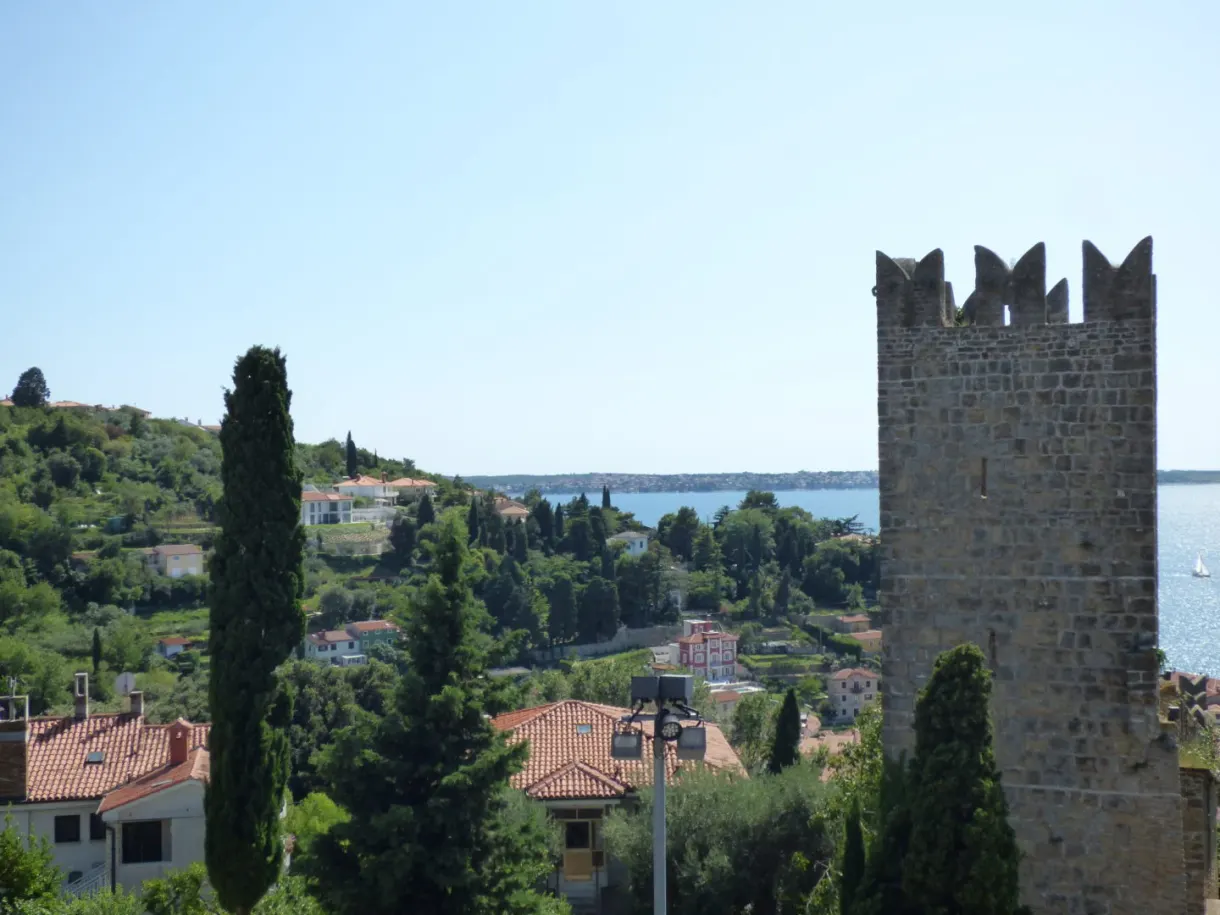 Crenellated tower of the ramparts standing above the bay