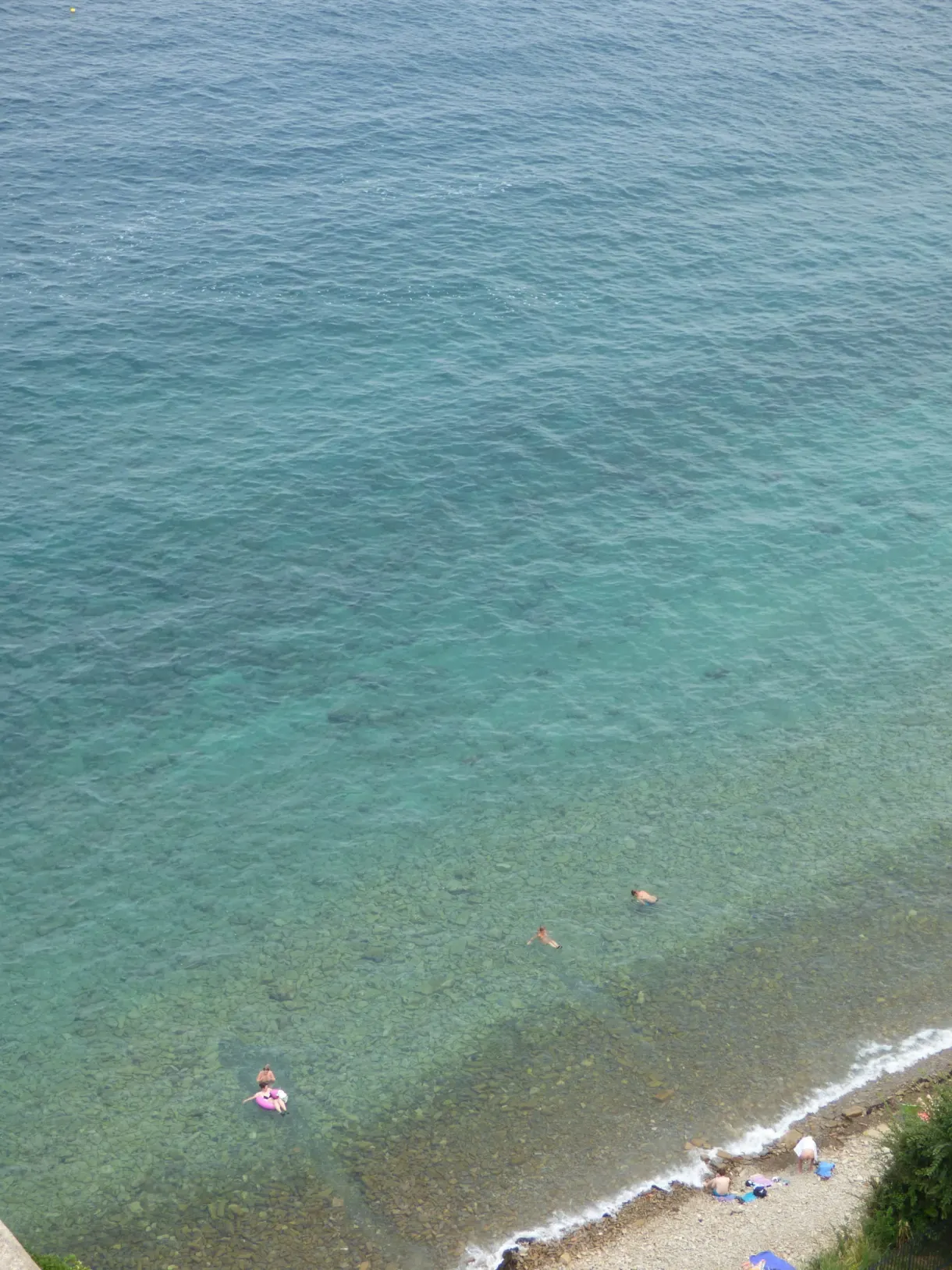 Turquoise water and swimmers seen from above