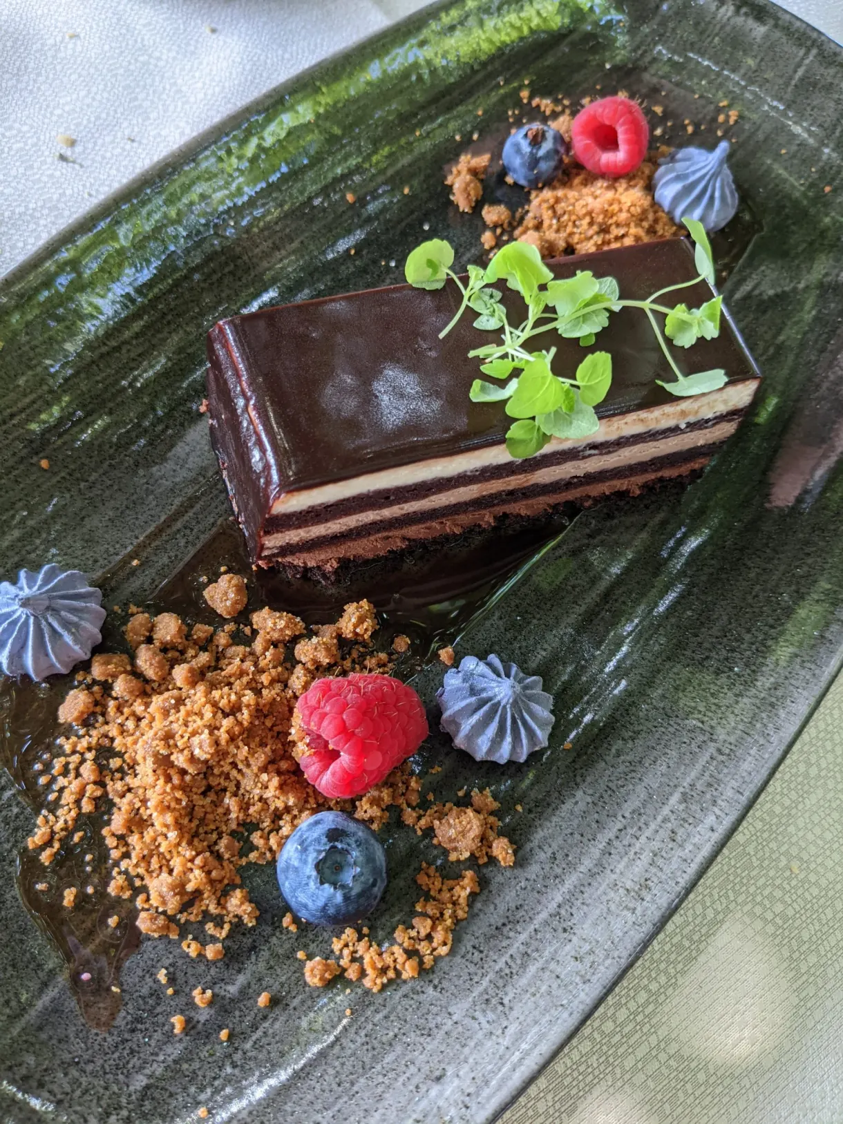Chocolate millefeuille, raspberries and blue meringues