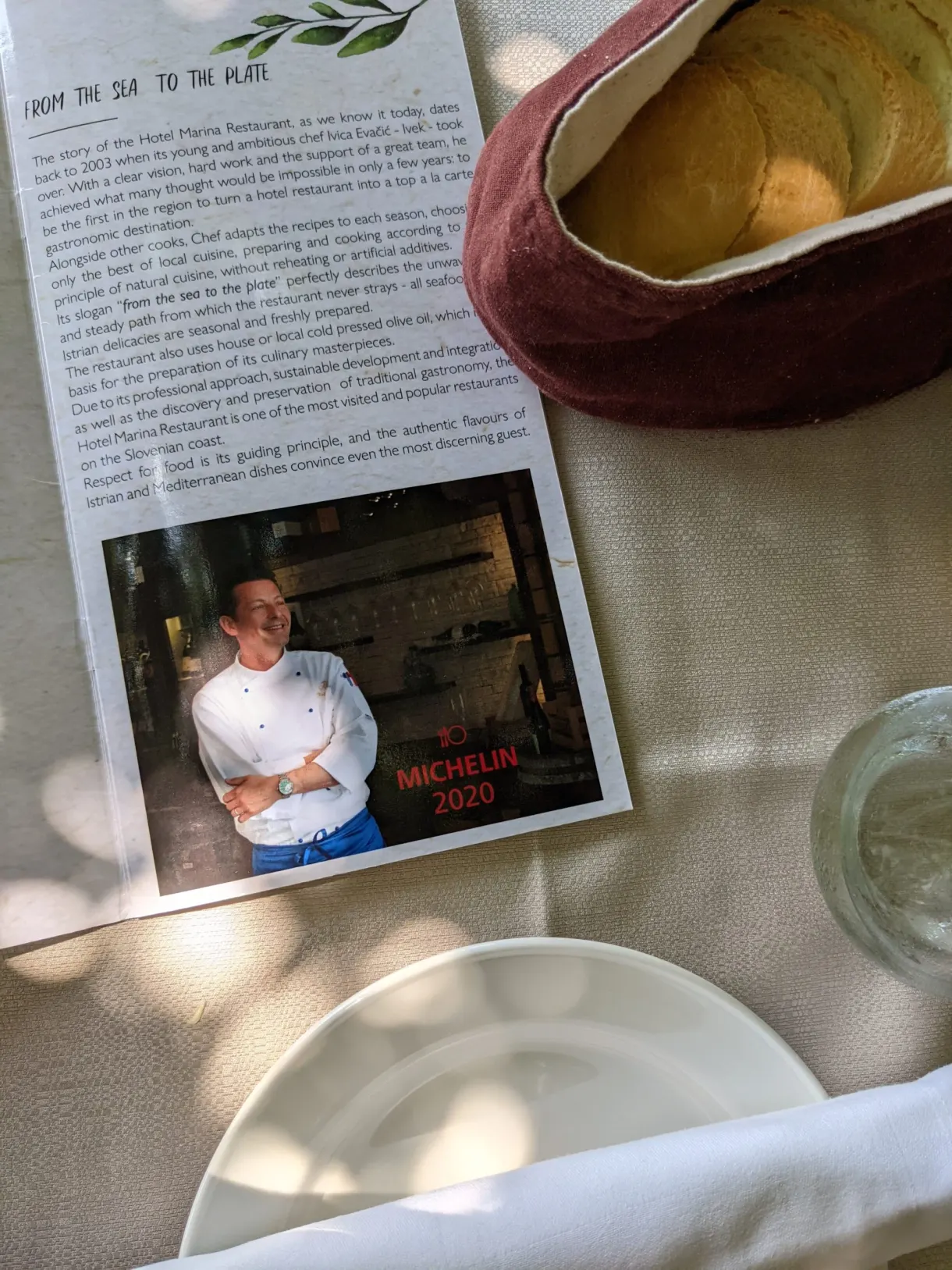 Bread basket and the chef's amuse-bouche set on the tablecloth