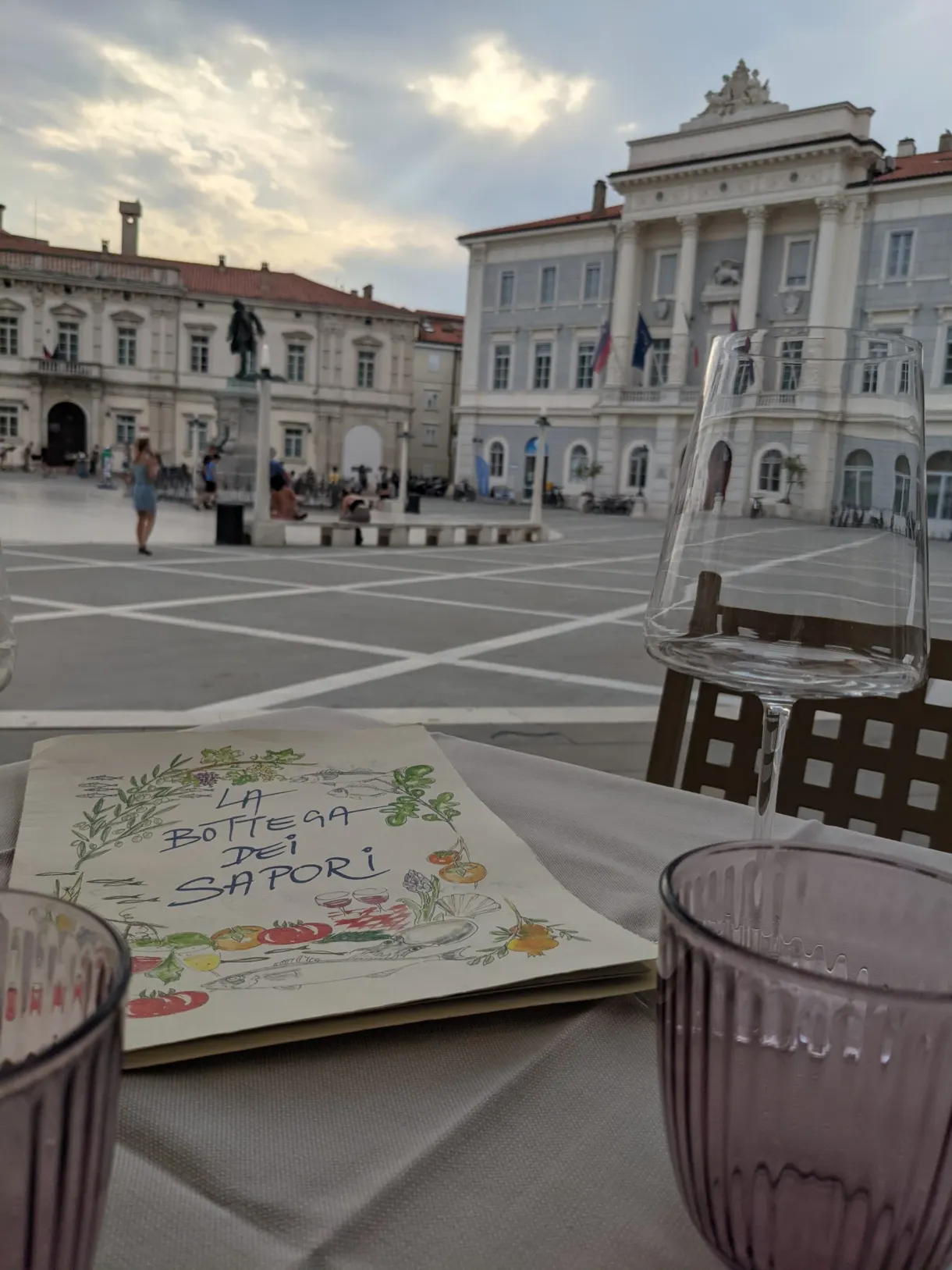 Illustrated menu on a table laid facing the square